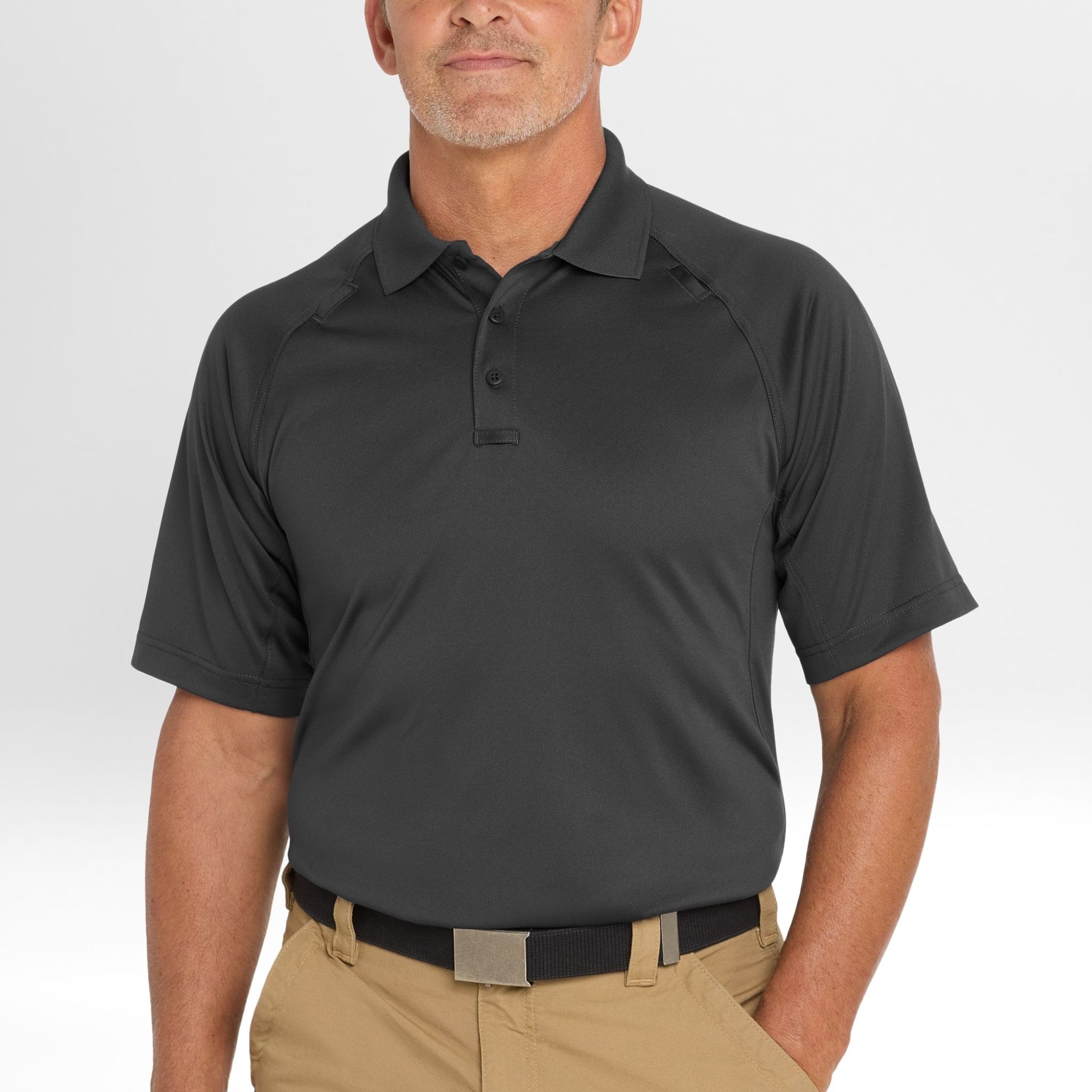 Man wearing a dark gray Snag-Proof Tactical Polo shirt on a white background