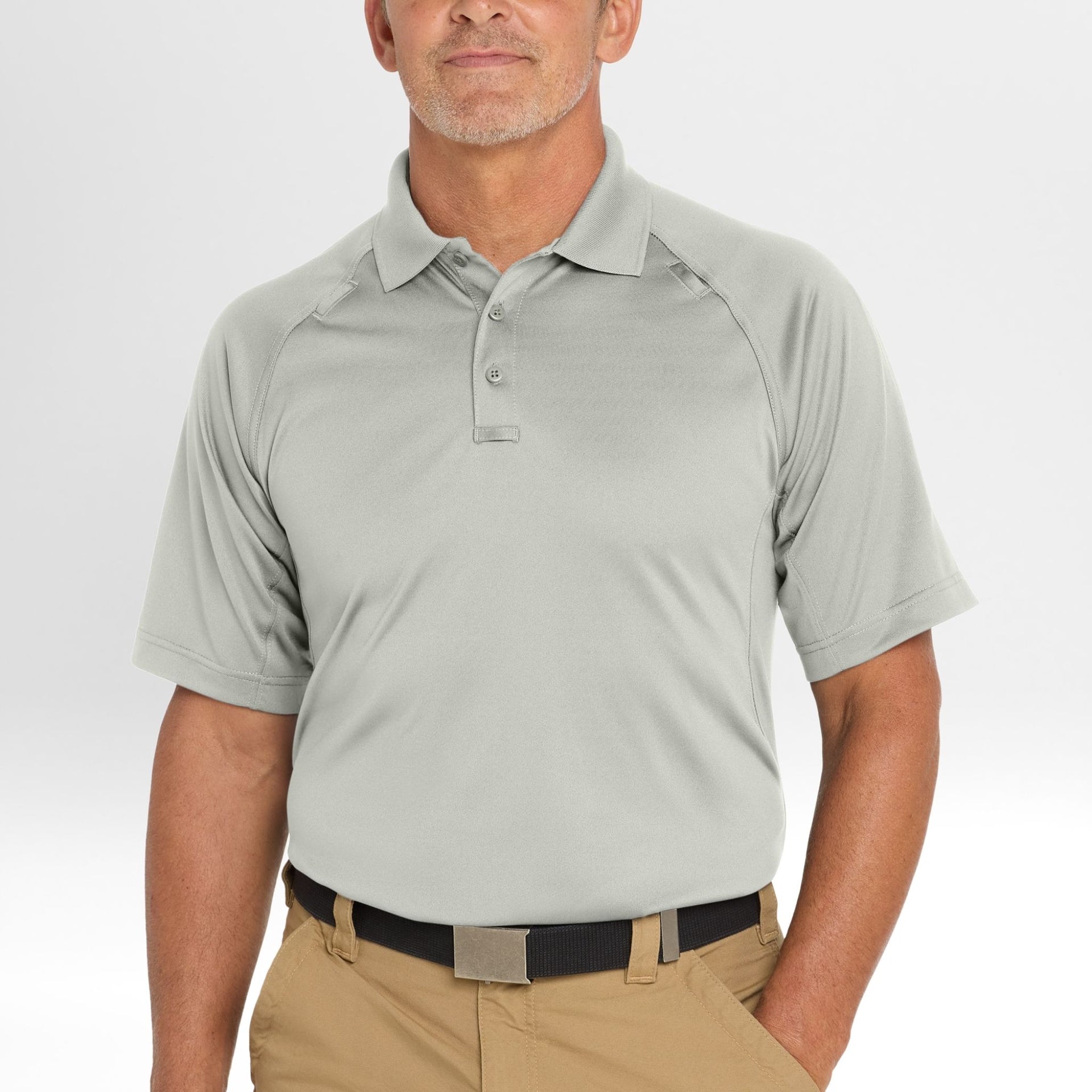Man wearing a light gray Snag-Proof Tactical Polo shirt and beige pants on a white background