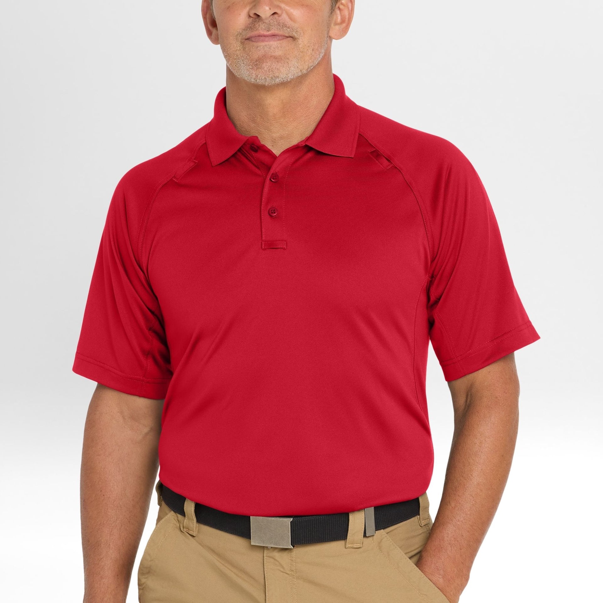 Man wearing a red Snag-Proof Tactical Polo shirt on a white background