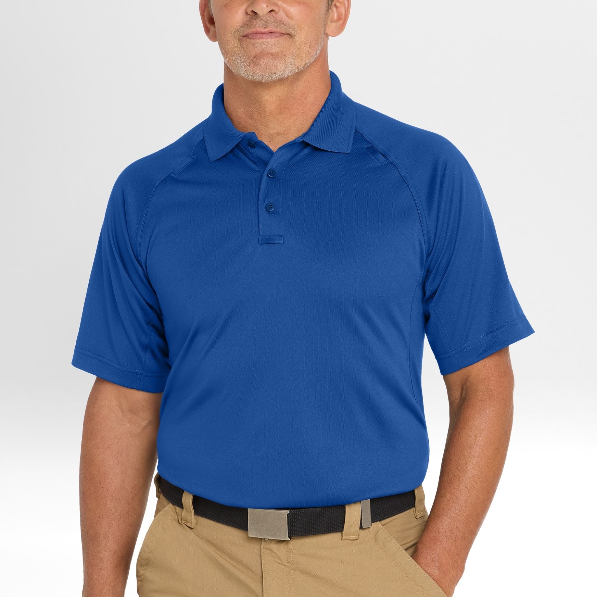 Man wearing a blue Snag-Proof Tactical Polo shirt on a white background