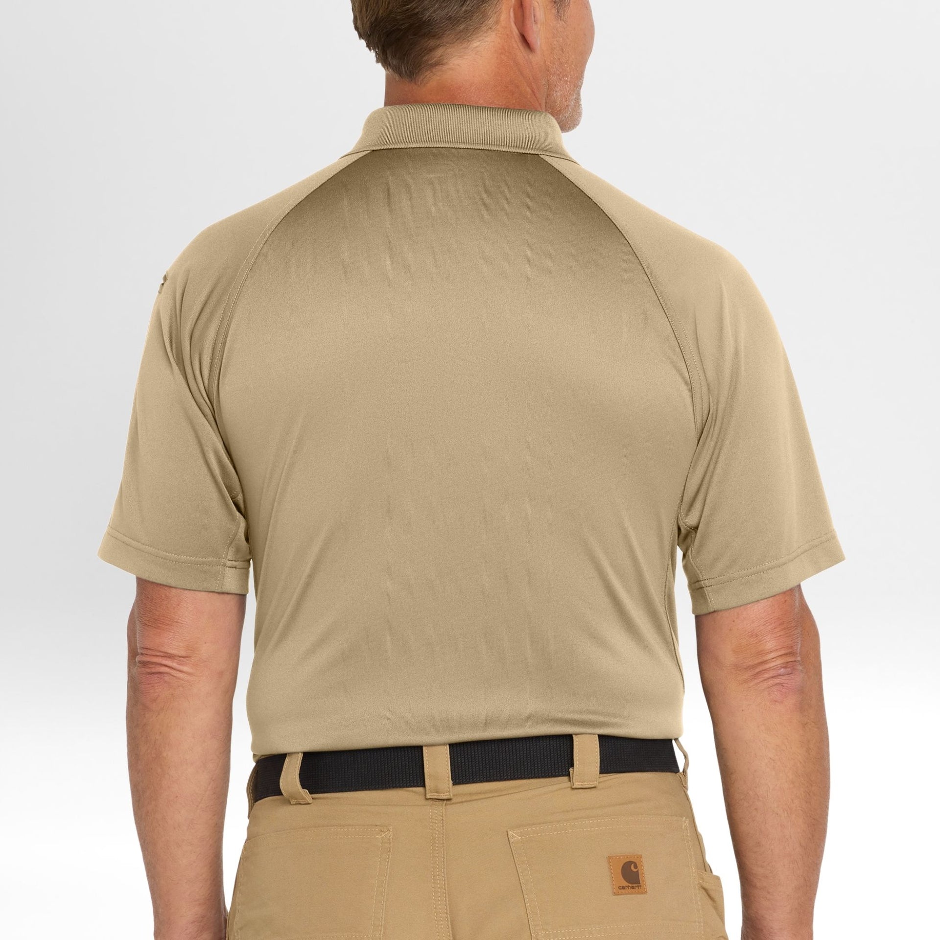 Man wearing a beige Snag-Proof Tactical Polo shirt and pants on a white background