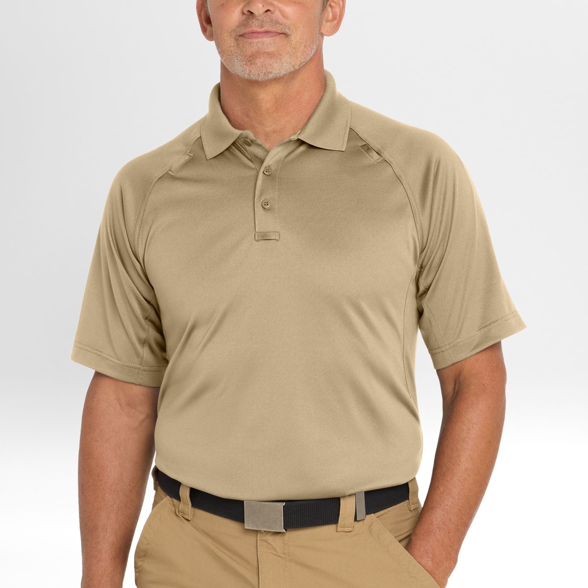 Man wearing a beige Snag-Proof Tactical Polo shirt and pants on a white background