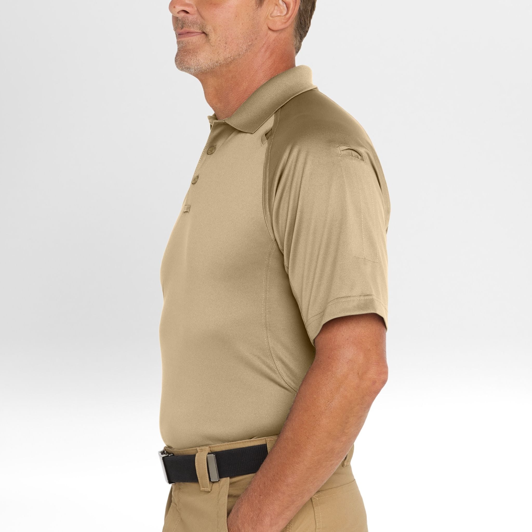 Man wearing a beige Snag-Proof Tactical Polo shirt and pants on a white background
