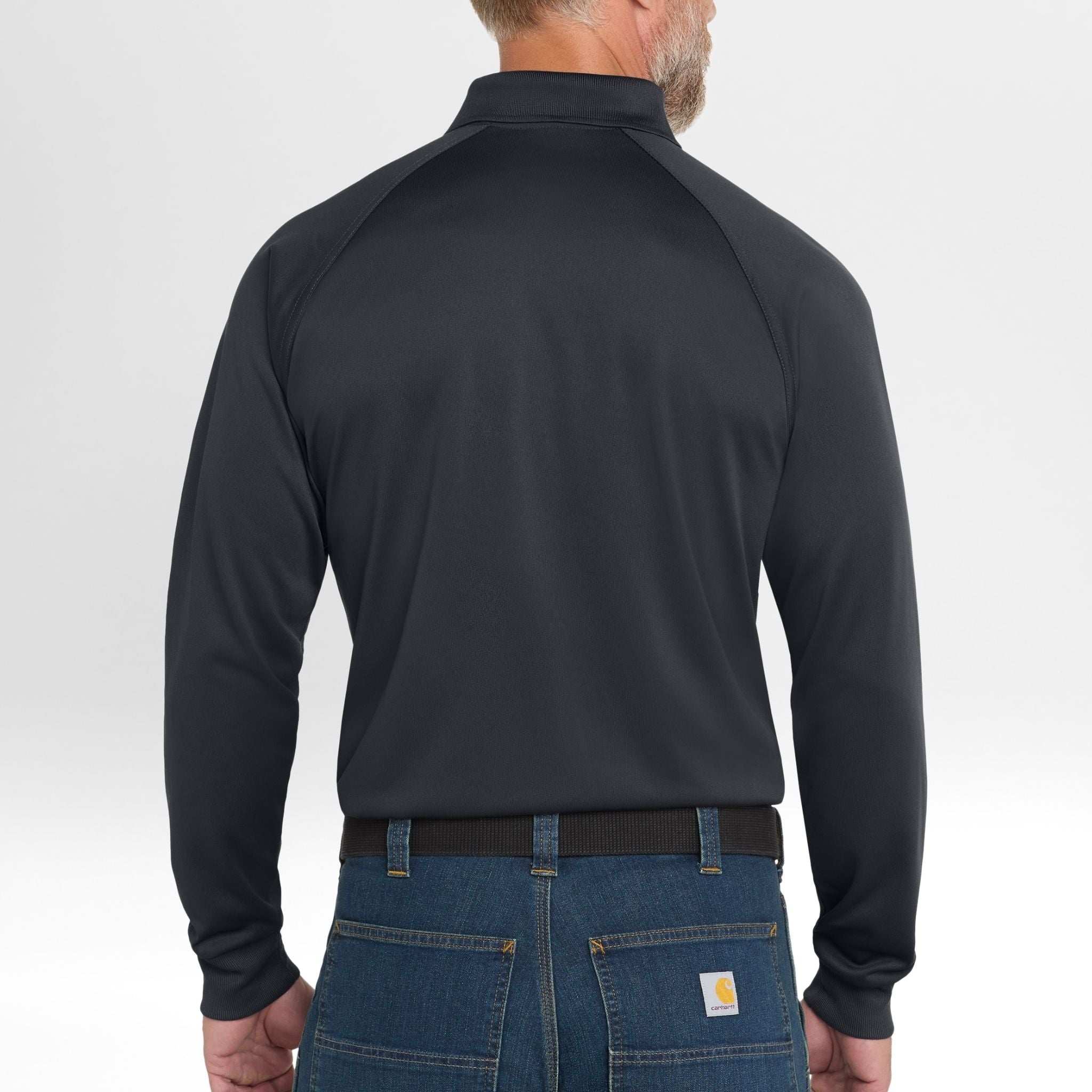 Person wearing a black long-sleeve Snag-Proof Tactical Polo shirt and blue jeans on a white background