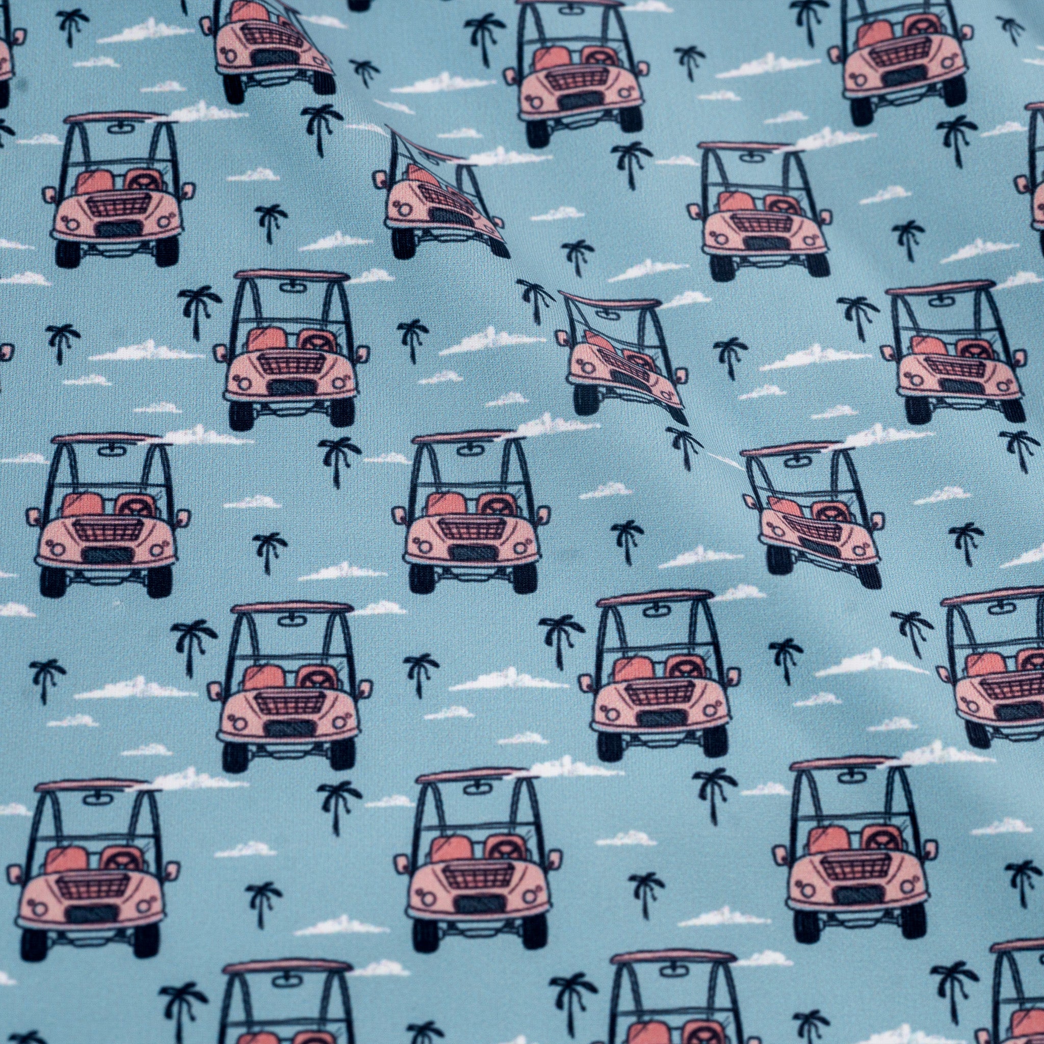 Pattern of pink golf carts and palm trees on a blue background