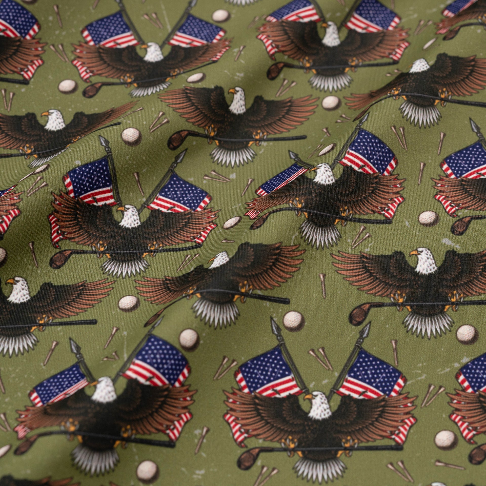 Pattern of eagles with American flags on a green background