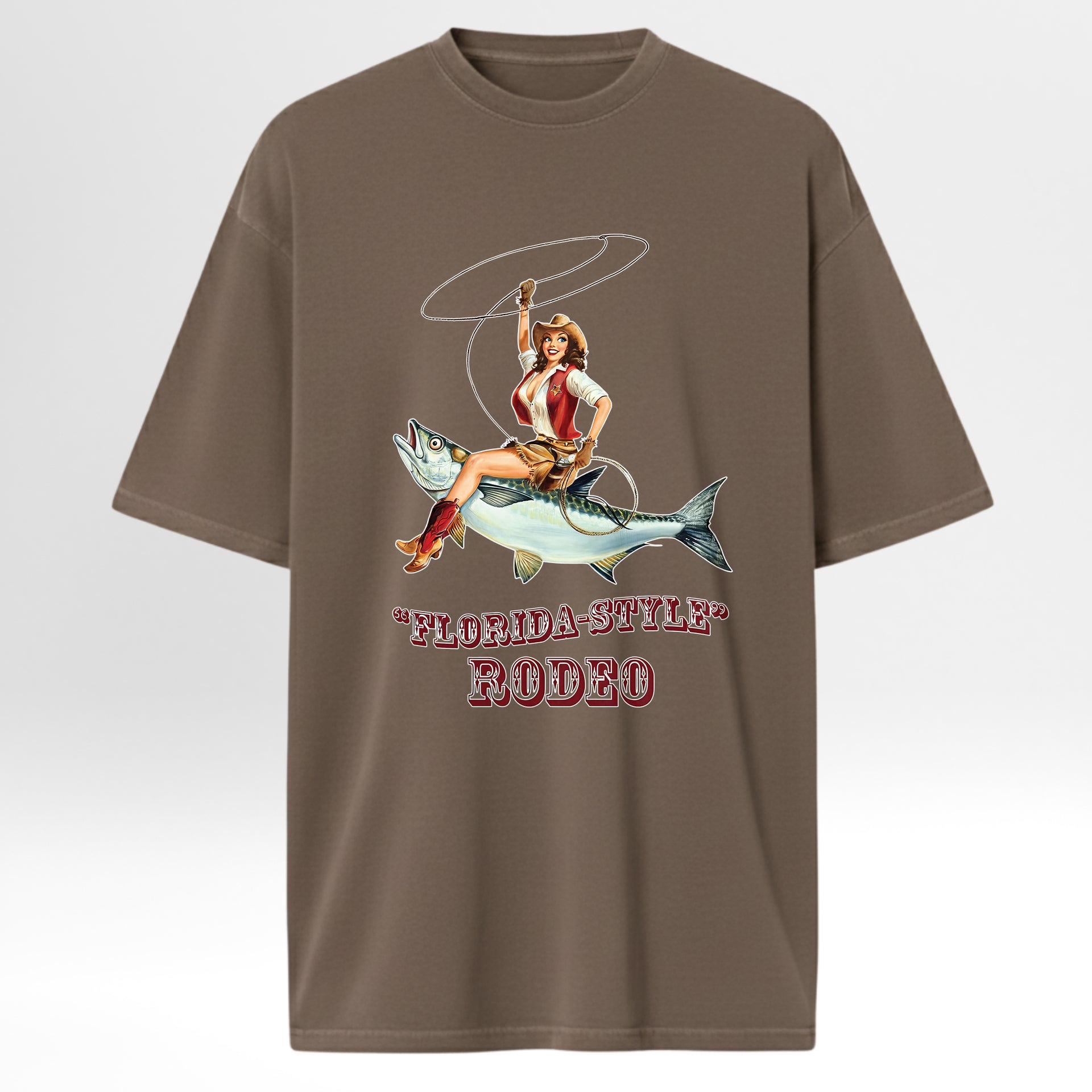 Brown fishing graphic t-shirt with a graphic of a woman riding a fish and 'Florida-Style Rodeo' text on a white background