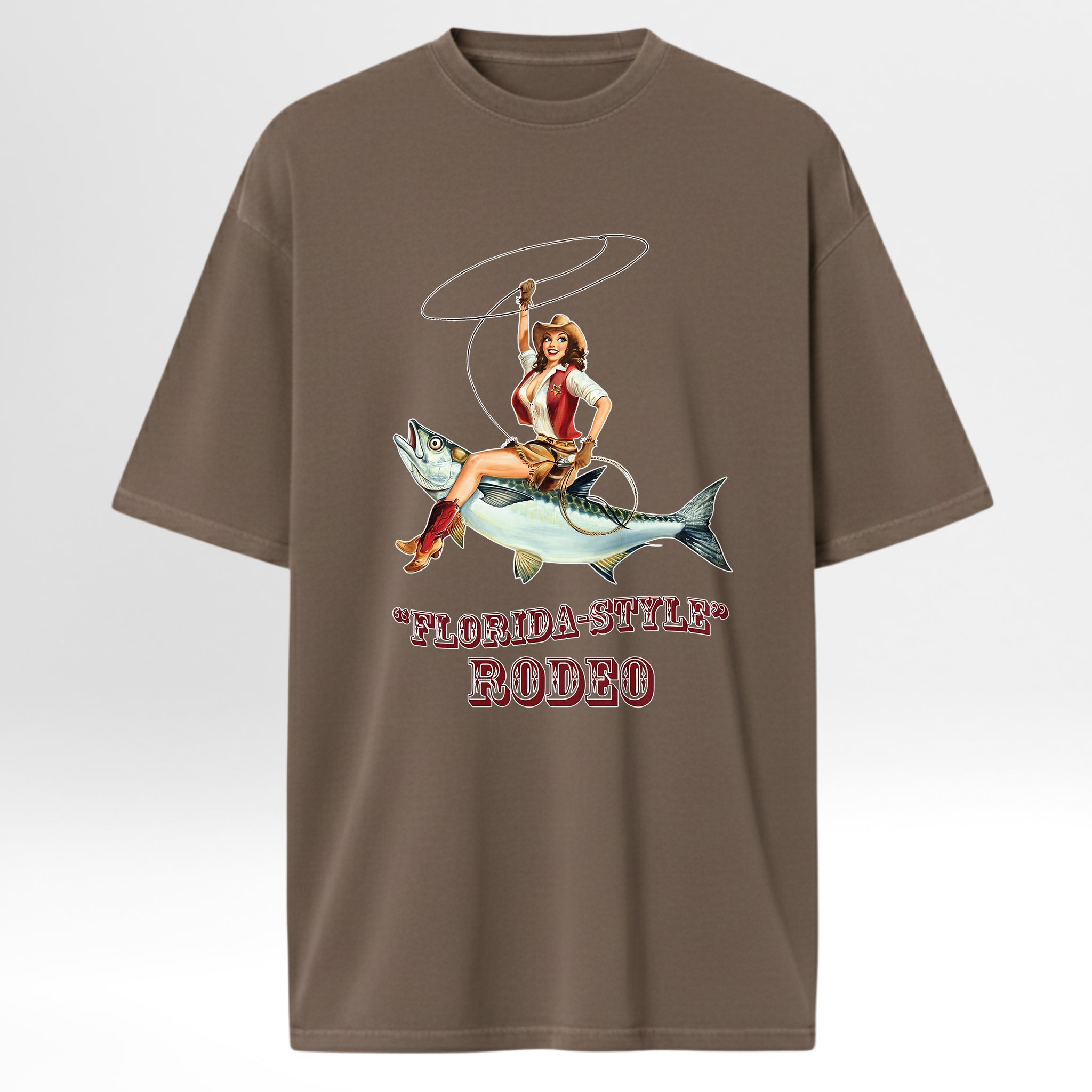 Brown fishing graphic t-shirt with a graphic of a woman riding a fish and 'Florida-Style Rodeo' text on a white background