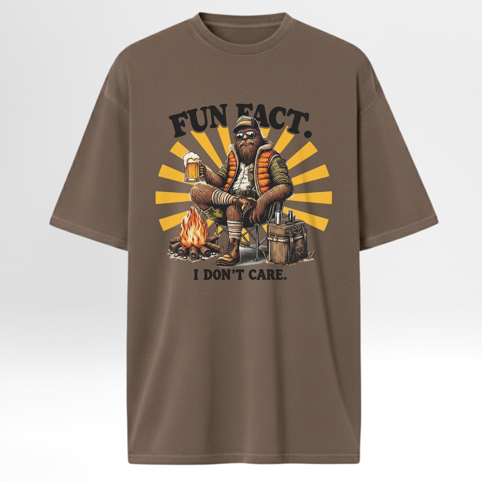 Brown camp & trail t-shirt with a graphic of a person by a campfire and text 'FUN FACT. I DON'T CARE.' 
