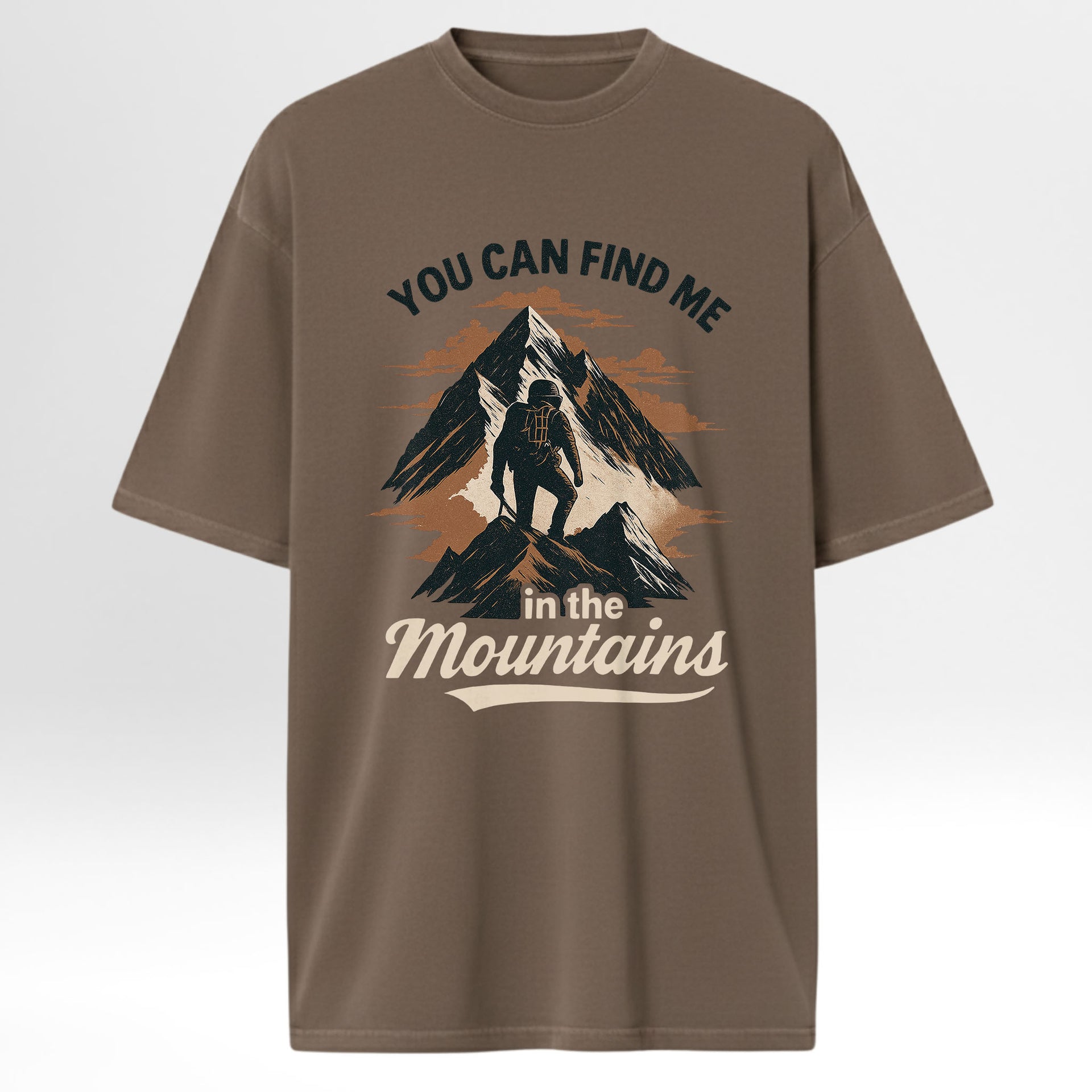 Brown camp & trail t-shirt with mountain graphic and text 'You Can Find Me In The Mountains'.