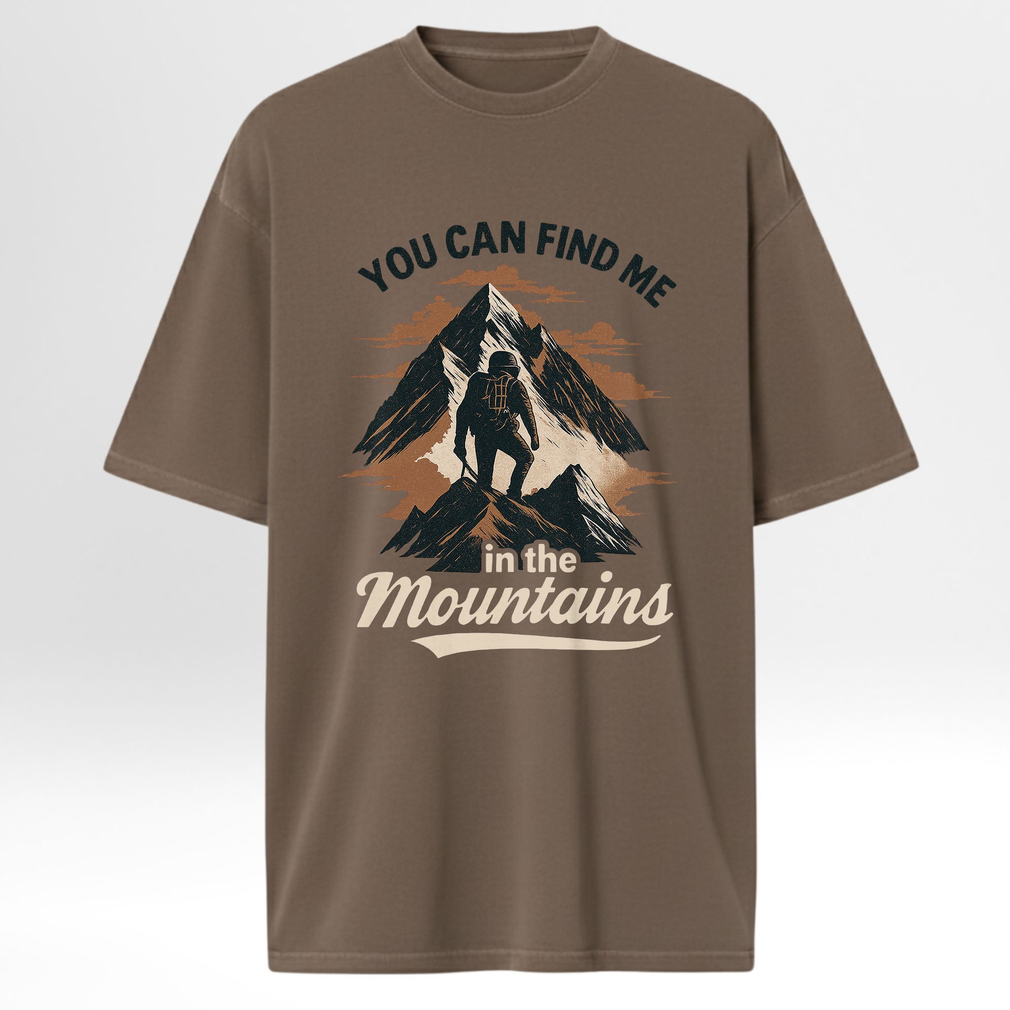 Brown camp & trail t-shirt with mountain graphic and text 'You Can Find Me In The Mountains'.