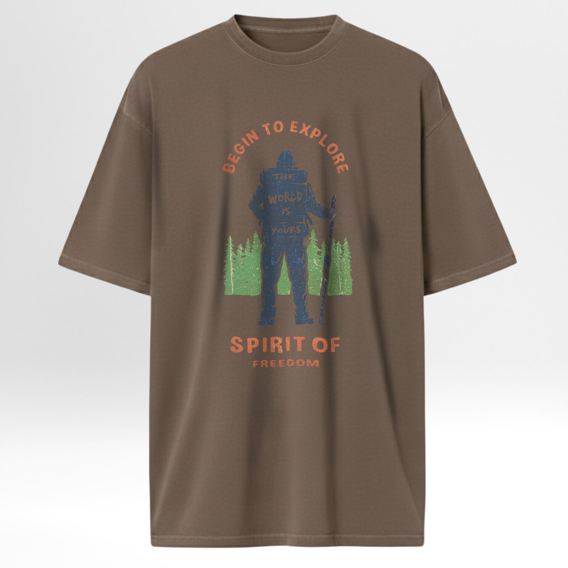 Brown t-shirt with graphic design featuring a silhouette and text 'Begin To Explore The World Is Yours Spirit Of Freedom'