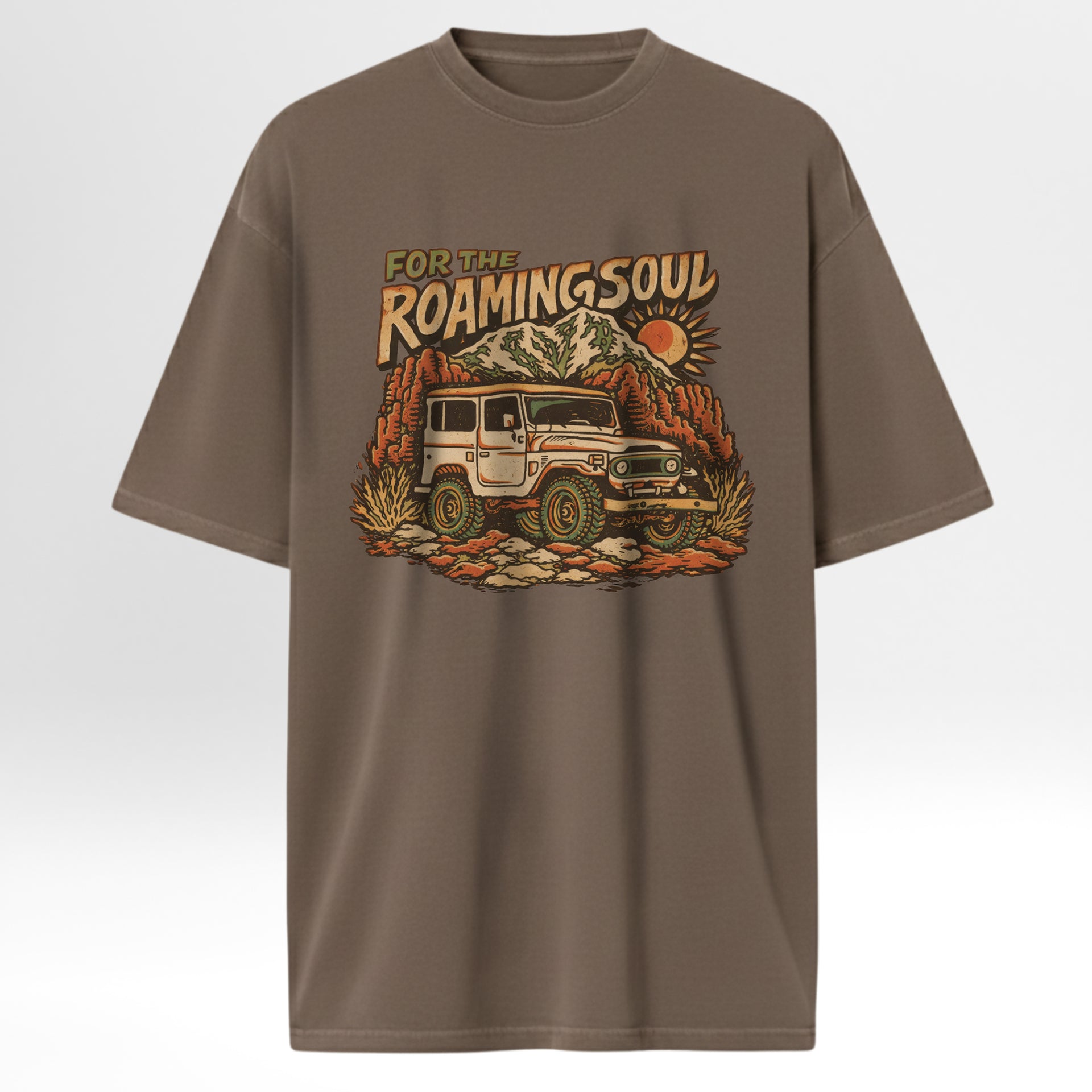 Brown t-shirt with a graphic of a vintage jeep and mountain landscape with text 'For The Roaming Soul'