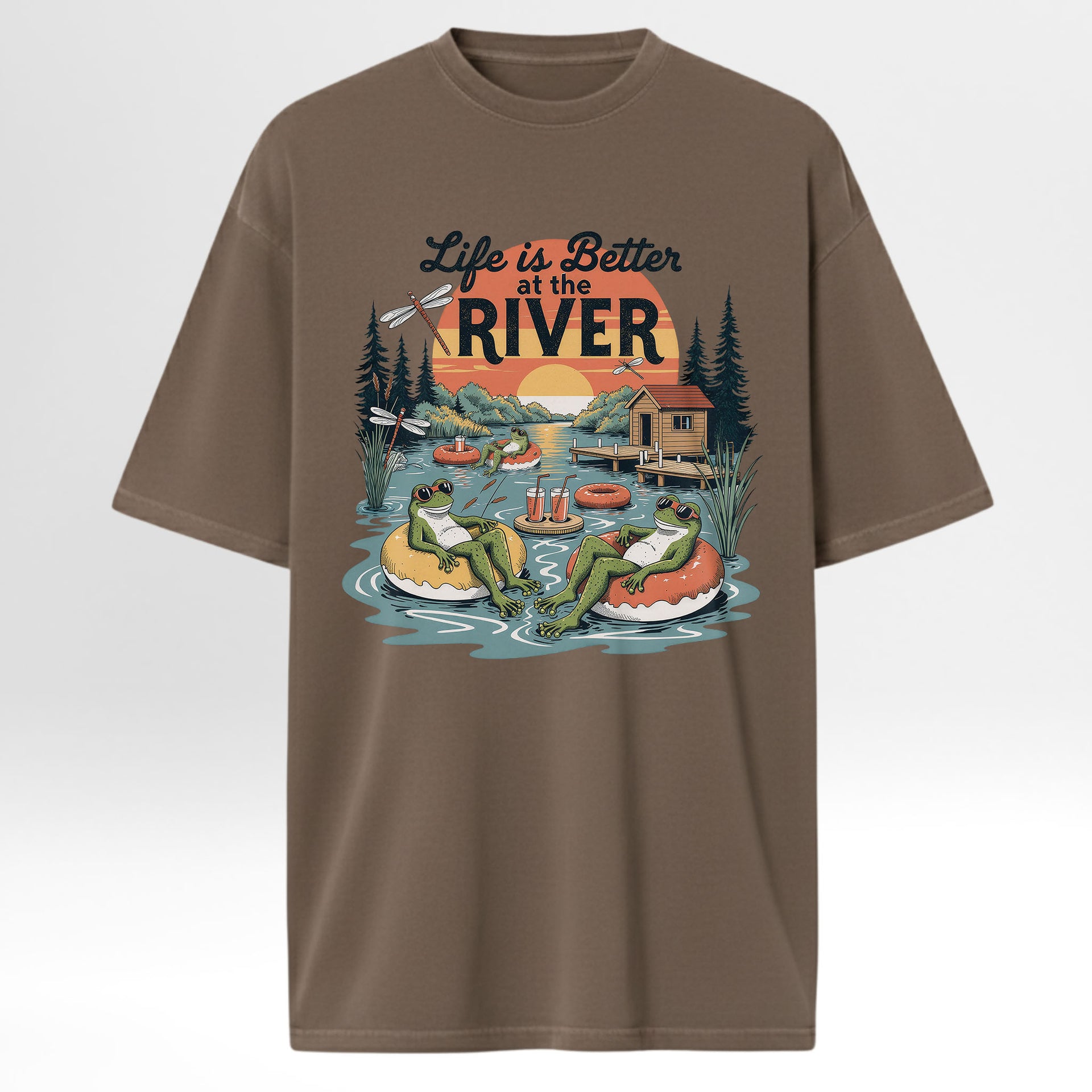 Brown t-shirt with 'Life is Better at the River' graphic design featuring frogs and a cabin.