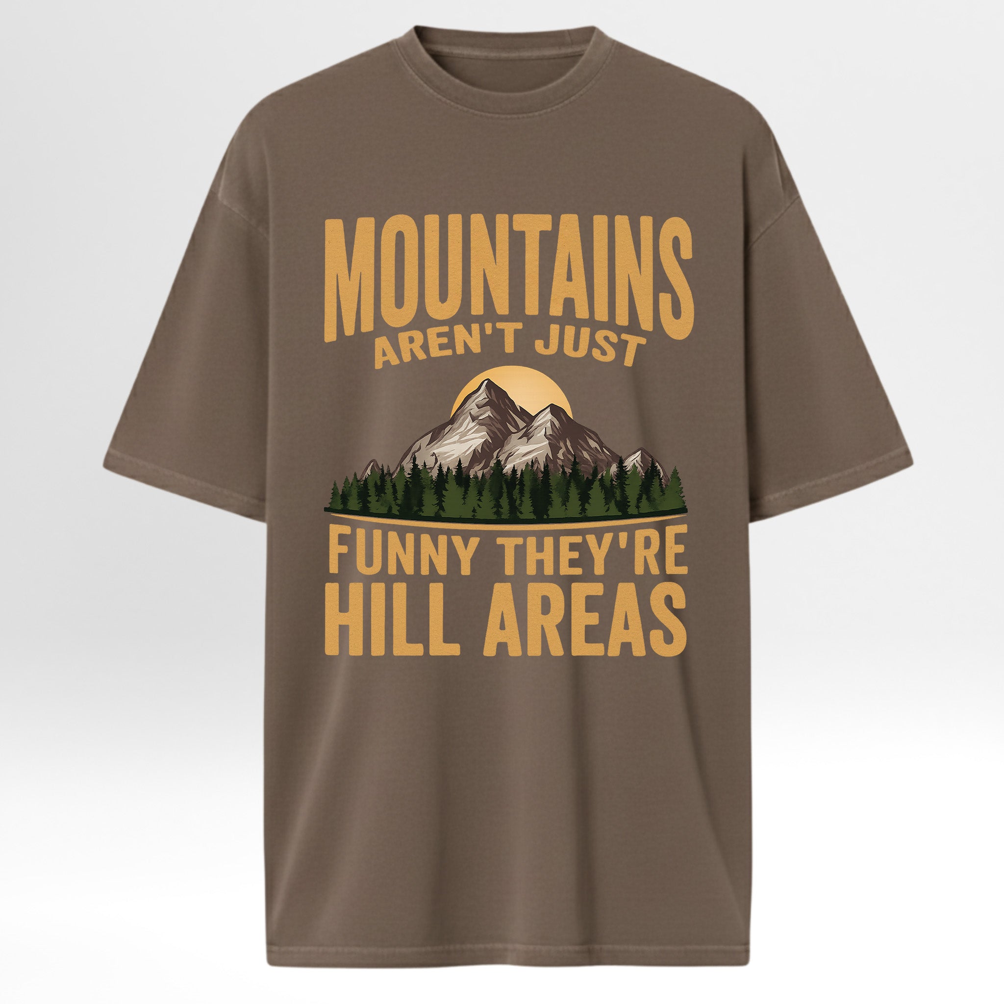 Brown t-shirt with mountain graphic and humorous text 'Mountains Aren't Just Funny They 're Hill Areas'