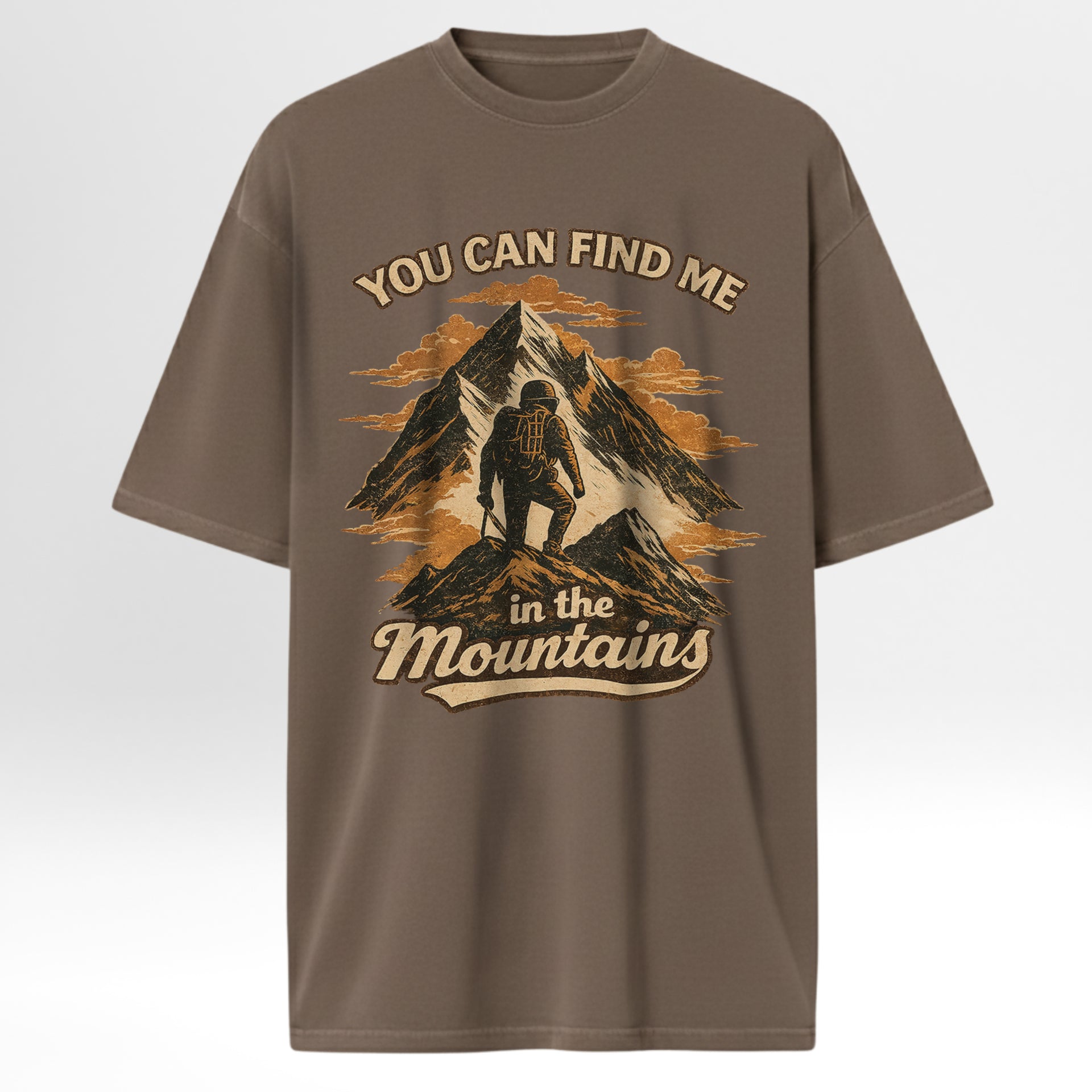 Brown outdoor t-shirt with camping graphic and text 'You Can Find Me In The Mountains'.