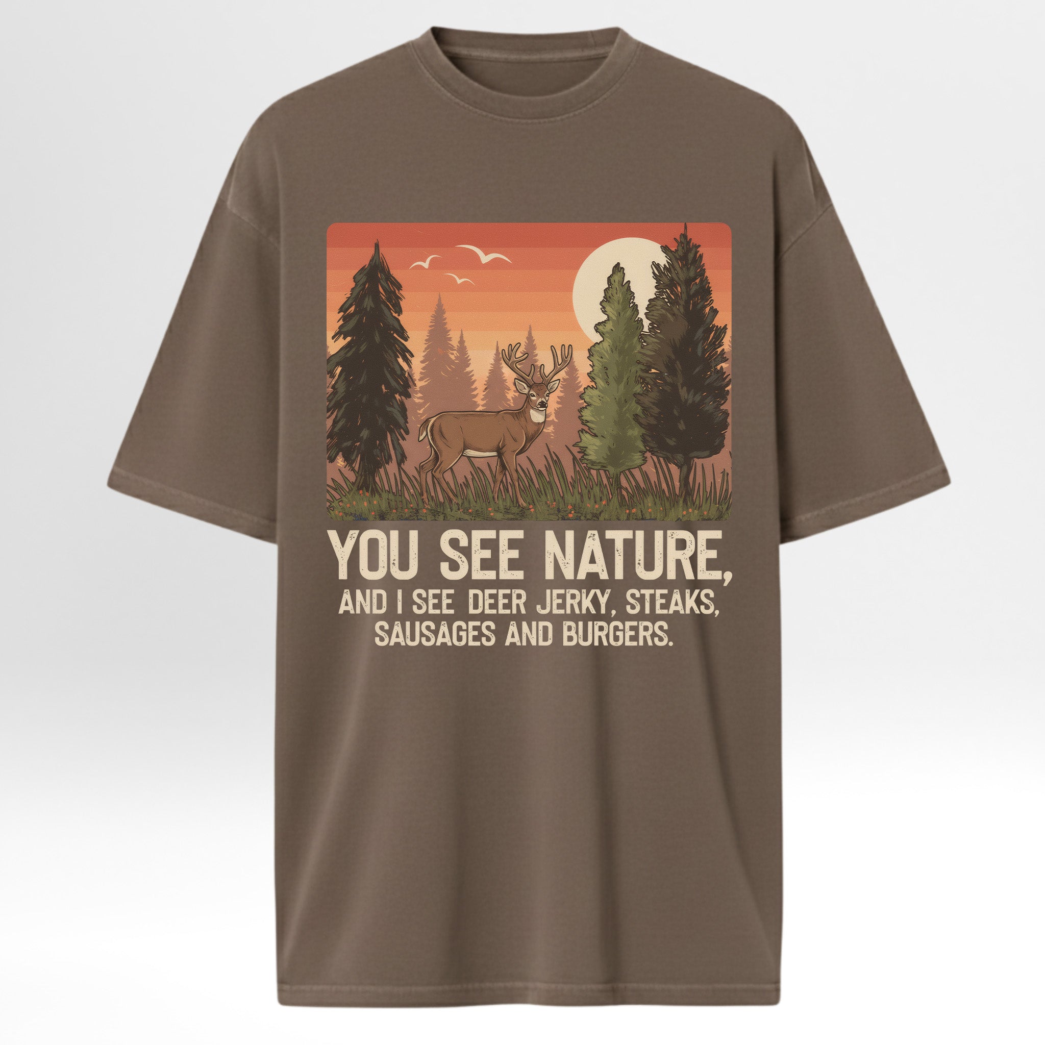 Brown t-shirt with a graphic of a deer in a forest and humorous text 'You See Nature And I See A Deer Jerky Steaks Sausages And Burgers'