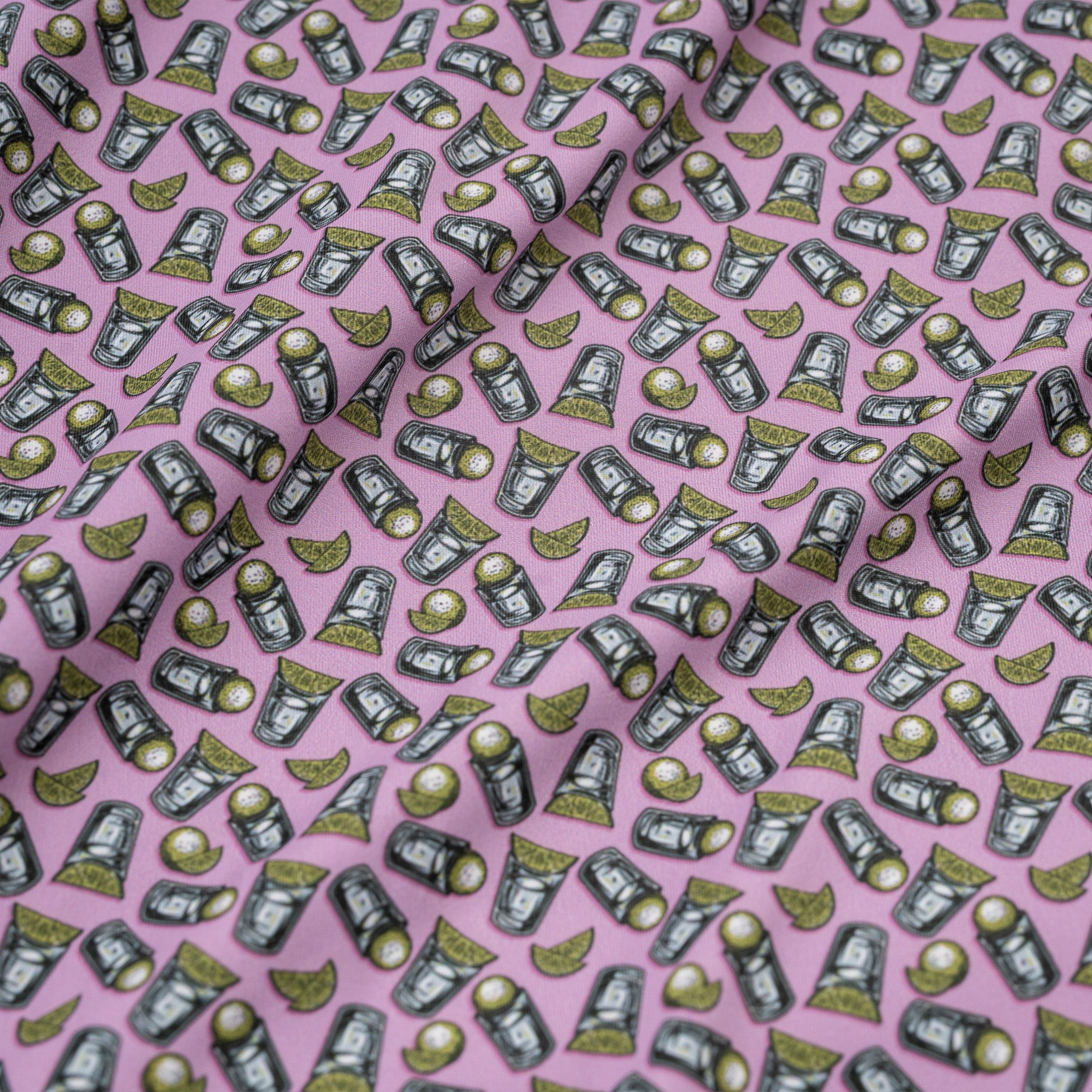 Pattern of tequila shots and limes on a pink background