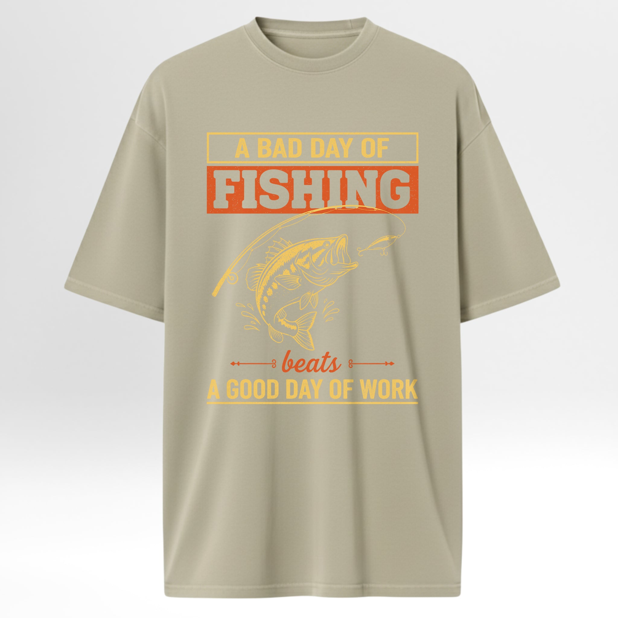 Beige fishing t-shirt with fishing graphic and text 'A Bad Day Of Fishing Beats A Good Day Of Work'.