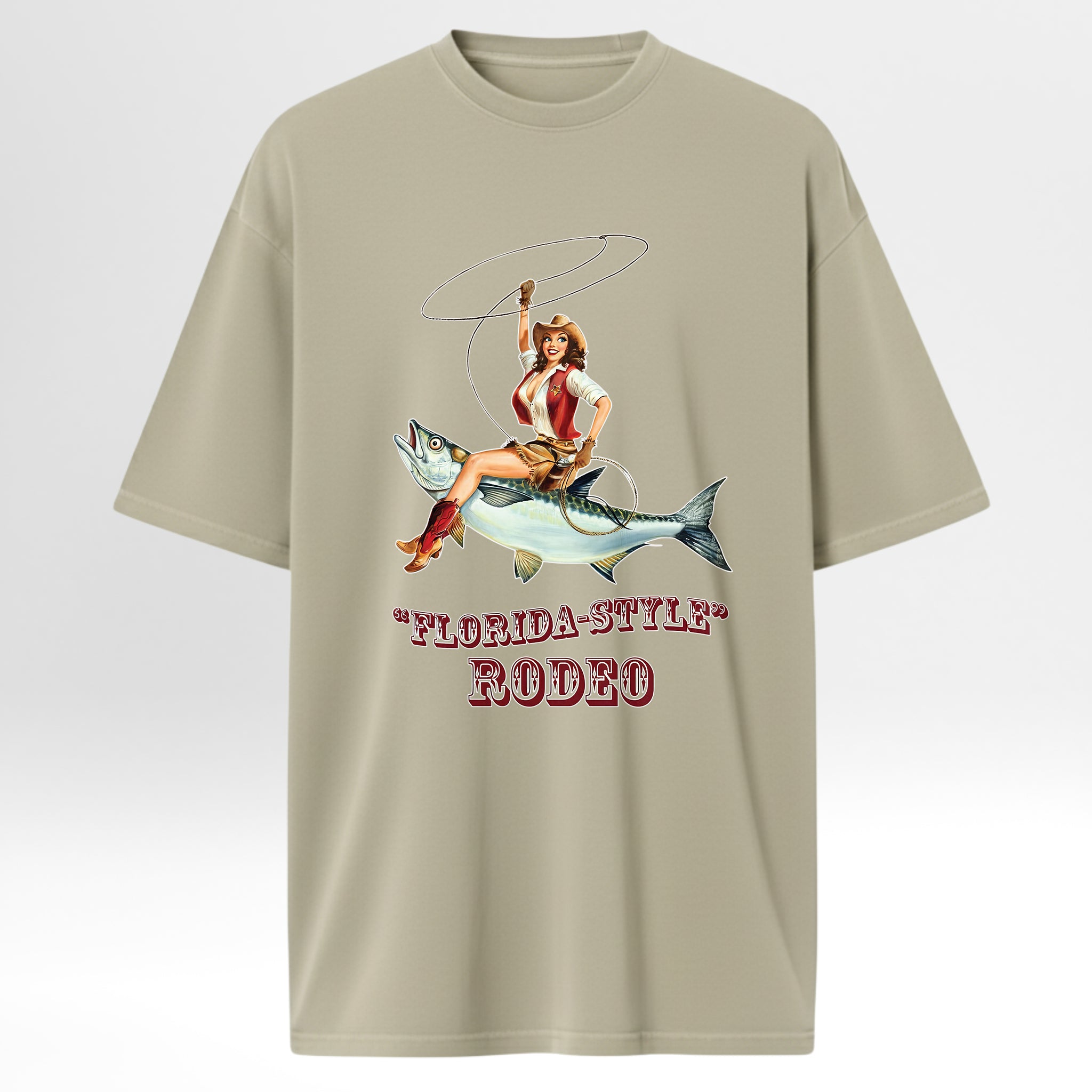Beige fishing graphic t-shirt with a graphic of a woman riding a fish and 'Florida-Style Rodeo' text on a white background