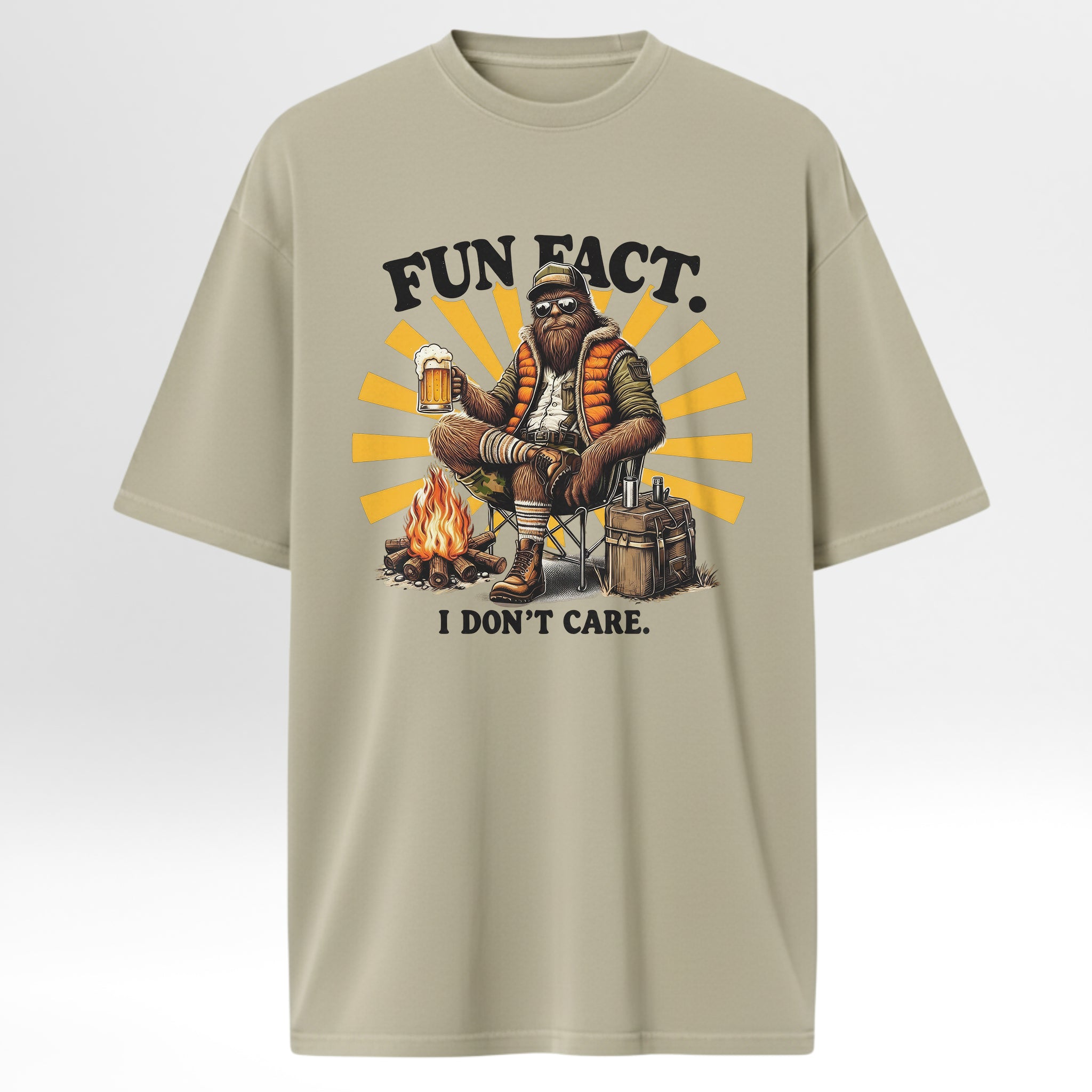 Beige camp & trail t-shirt with a graphic of a person by a campfire and text 'FUN FACT. I DON'T CARE.'