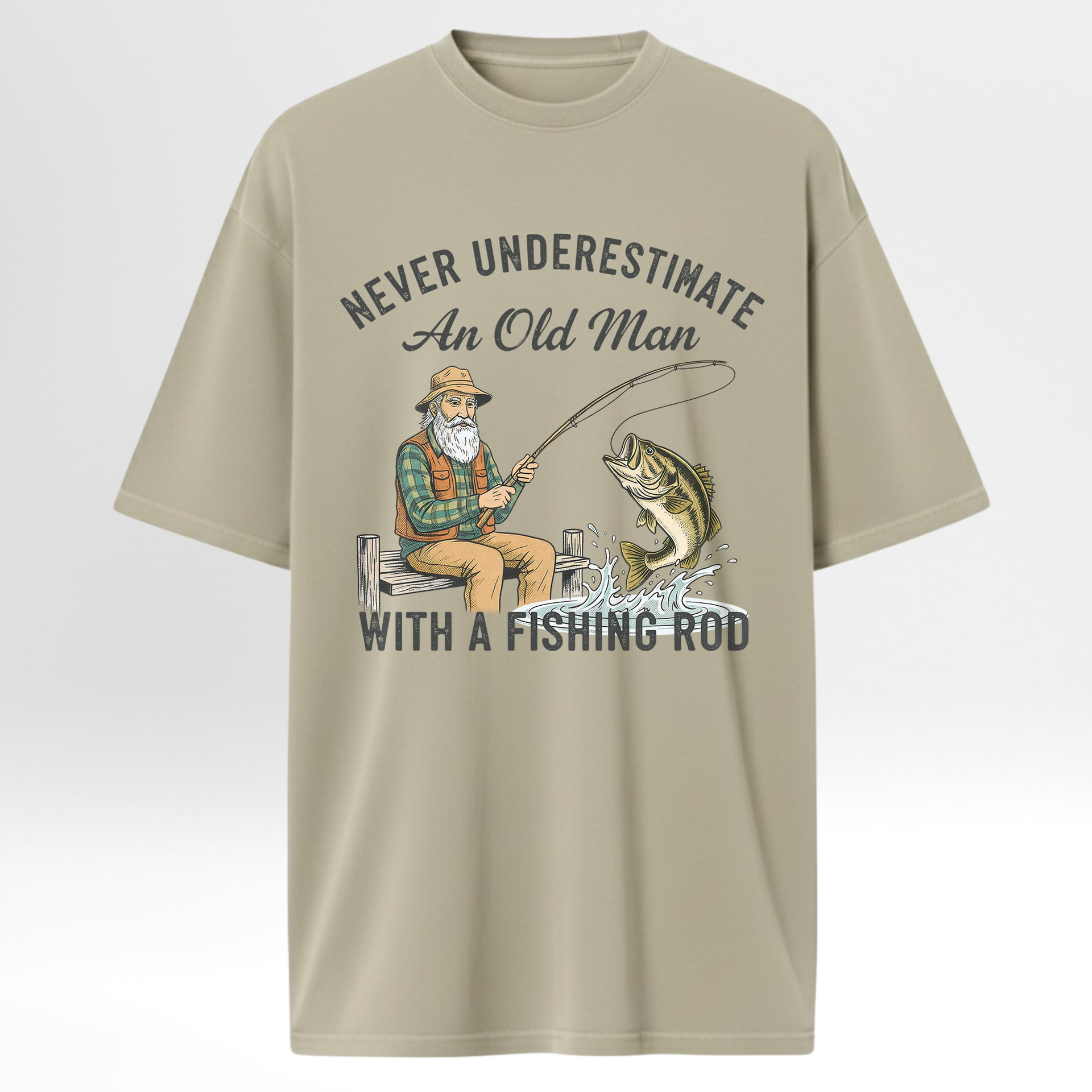Beige fishing t-shirt with fishing graphic and text 'Never Underestimate An Old Man With A Fishing Rod'.