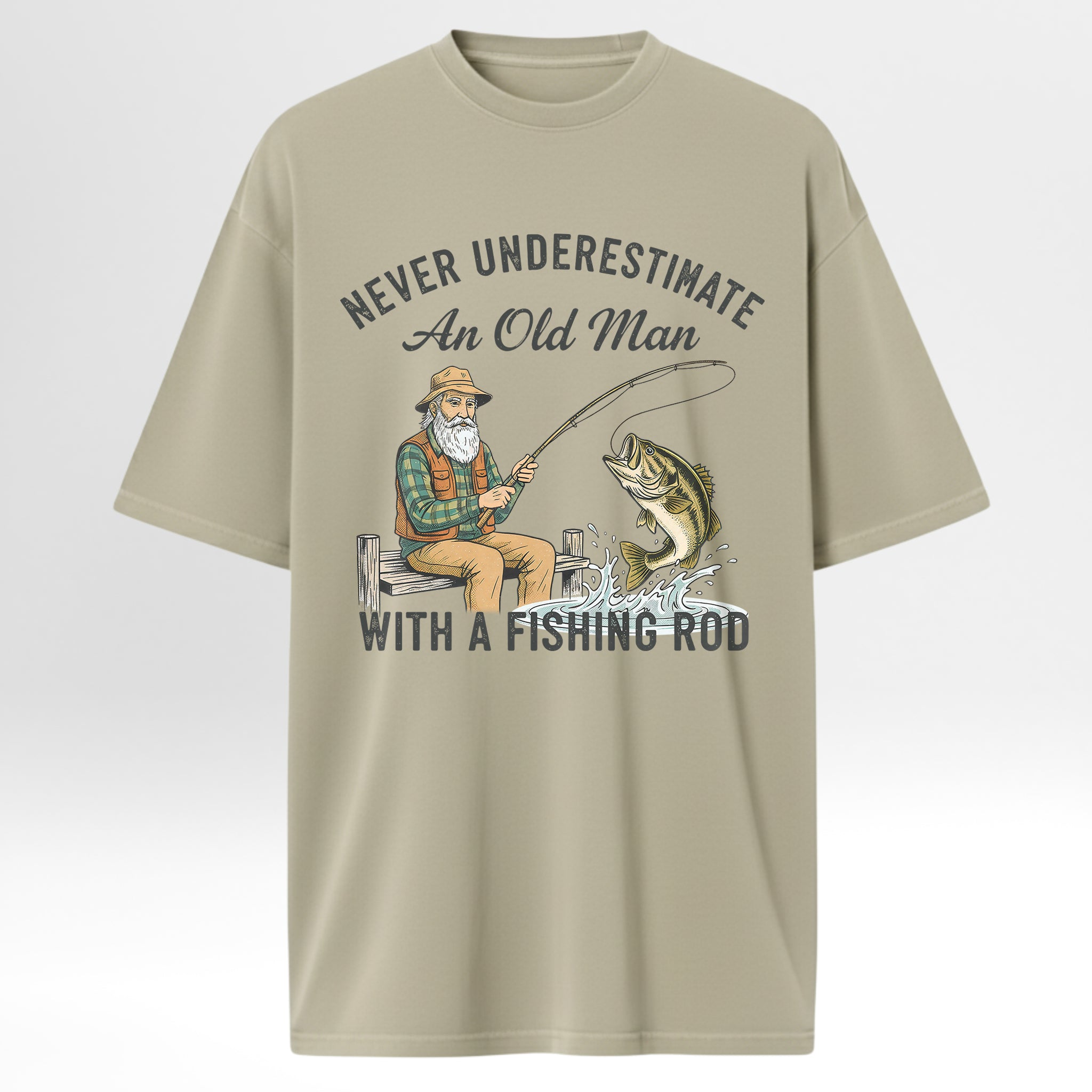 Beige fishing t-shirt with fishing graphic and text 'Never Underestimate An Old Man With A Fishing Rod'.