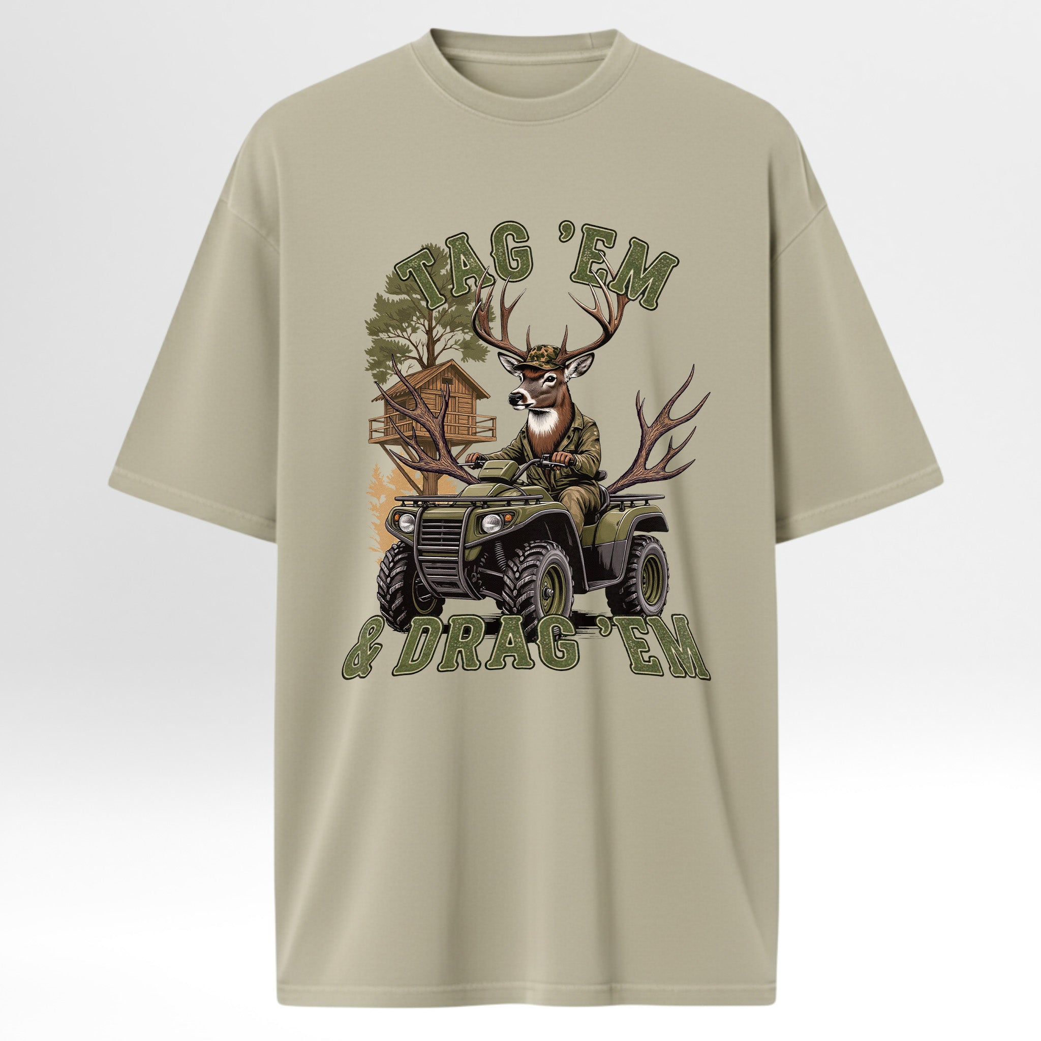 Beige hunting t-shirt with a graphic of a deer on an ATV and text 'Tag 'Em & Drag 'Em'.