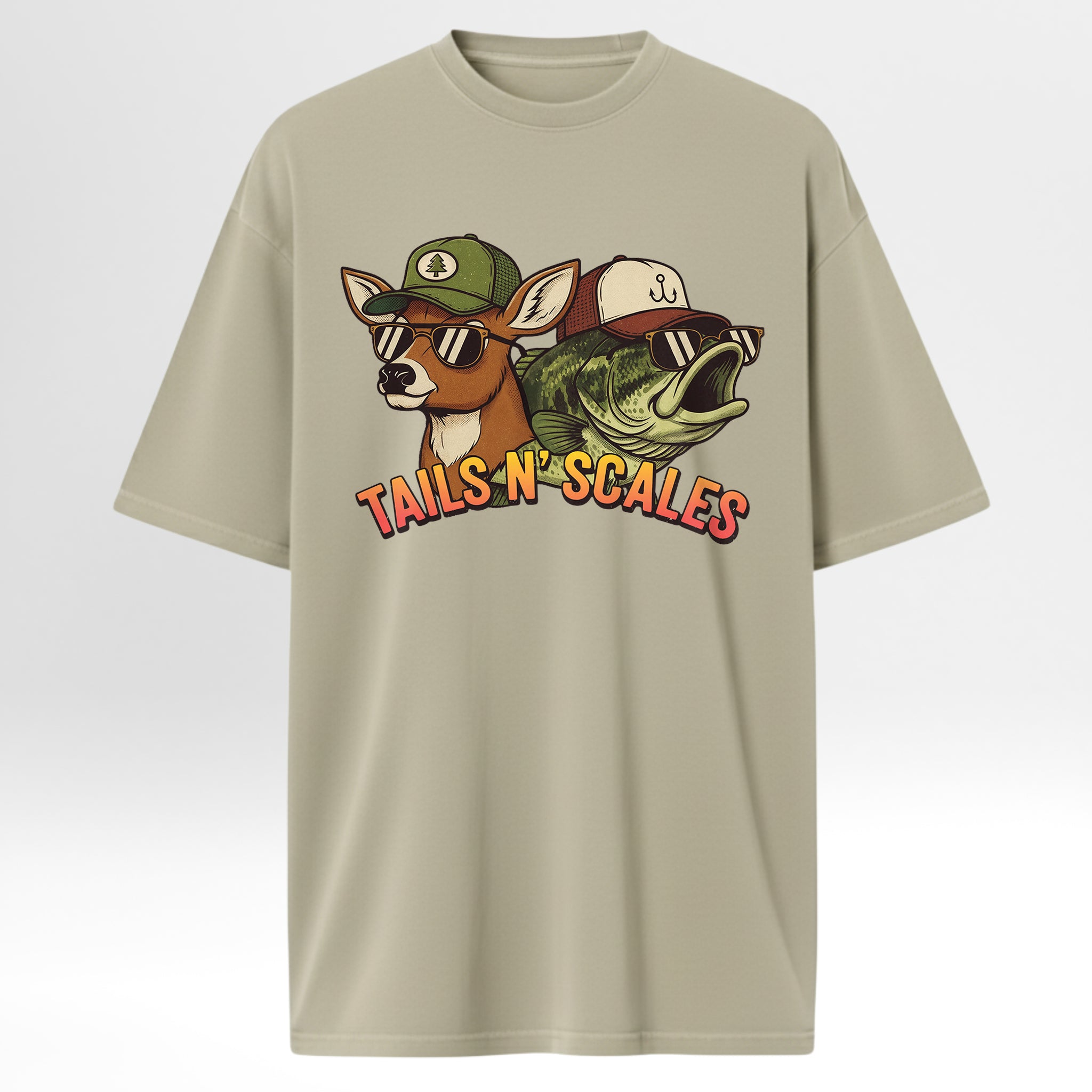 Beige hunting and fishing t-shirt with a graphic of a deer, fish, and hats with 'TAILS N' SCALES' text.