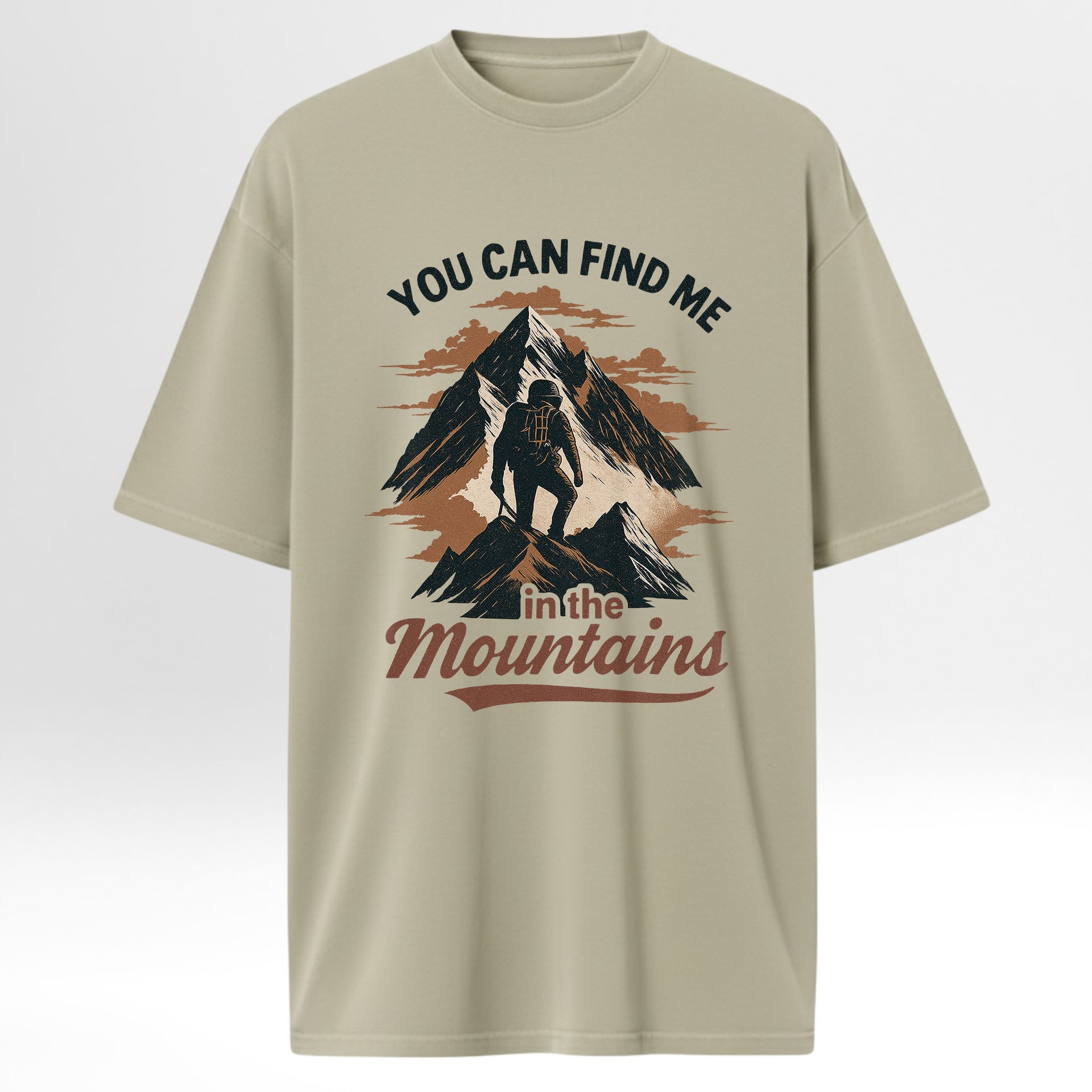 Beige camp & trail t-shirt with mountain graphic and text 'You Can Find Me In The Mountains'.