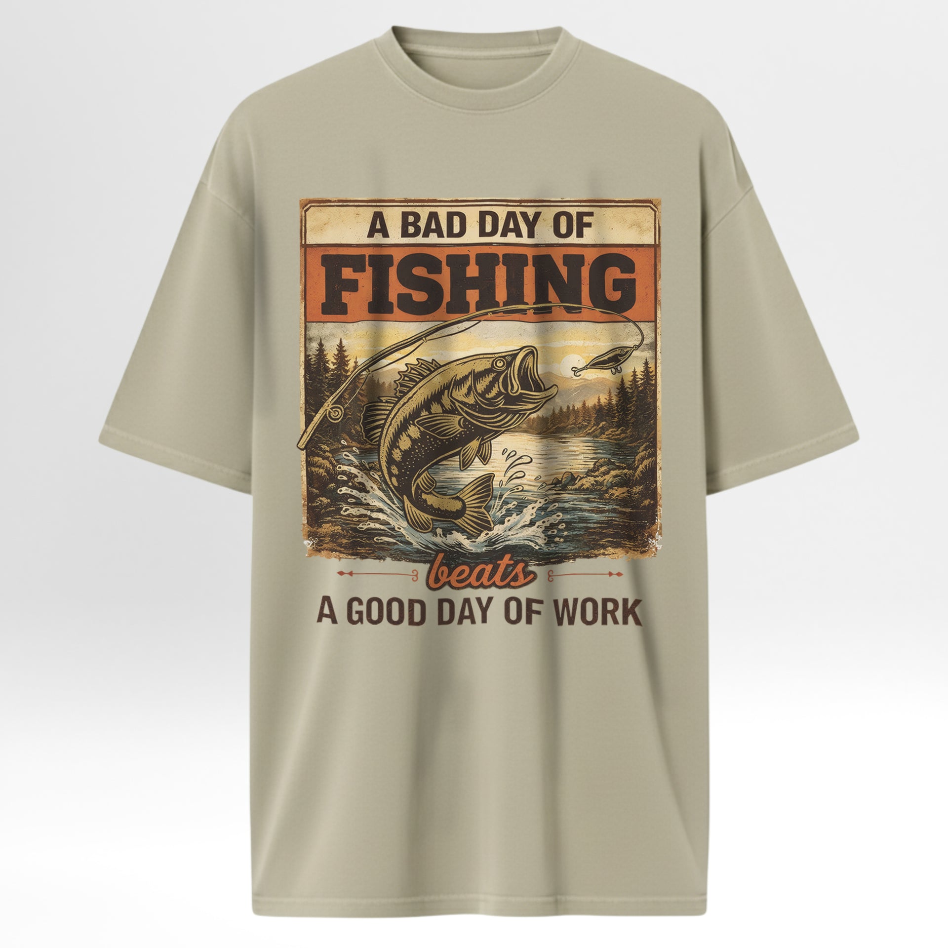 Beige fishing t-shirt with fishing graphic and text 'A Bad Day Of Fishing Beats A Good Day Of Work'.