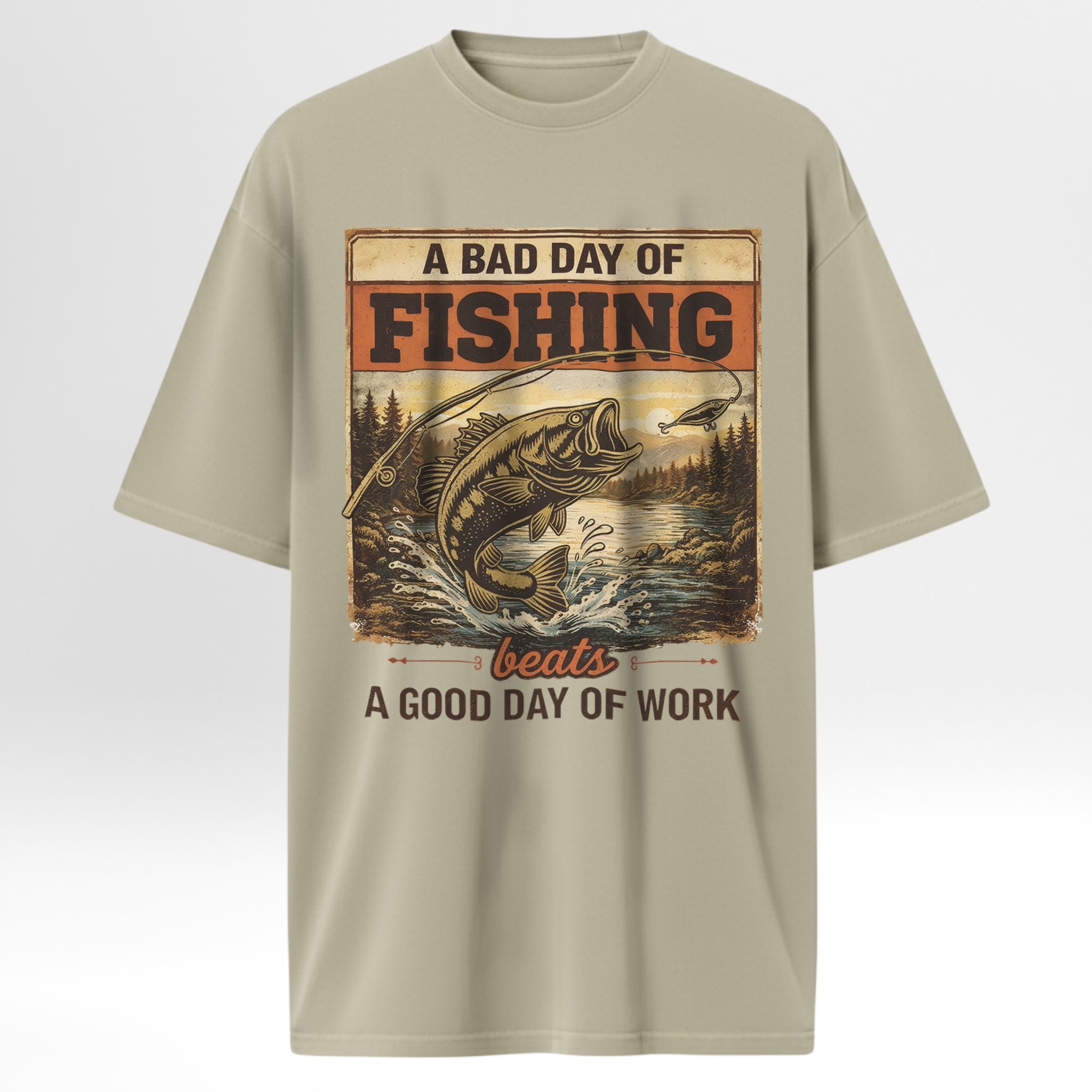 Beige fishing t-shirt with fishing graphic and text 'A Bad Day Of Fishing Beats A Good Day Of Work'.