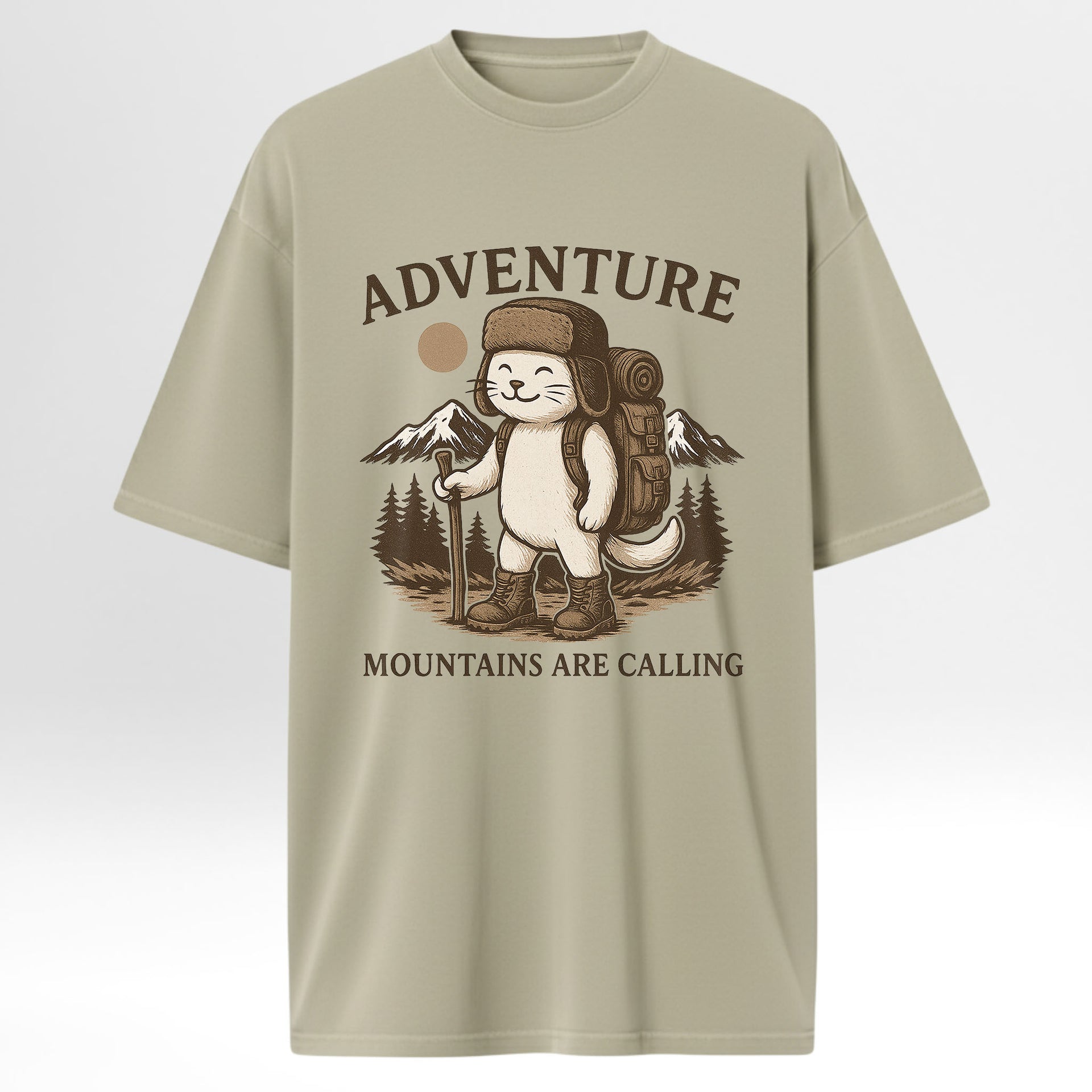 Beige trail graphic t-shirt with a graphic of a bear in a hat and backpack, holding a sign that says 'Adventure Mountains Are Calling' on a light gray background.