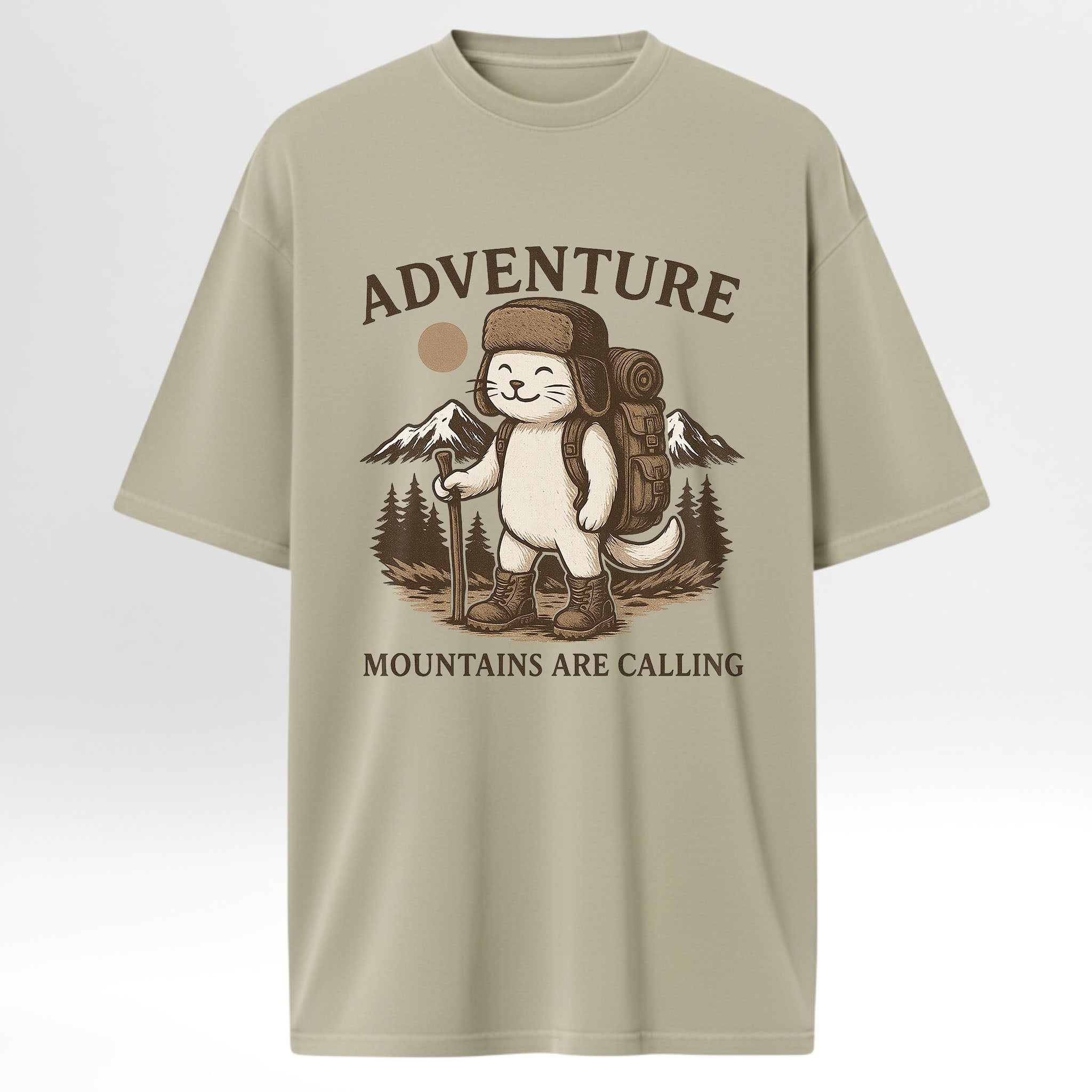 Beige trail graphic t-shirt with a graphic of a bear in a hat and backpack, holding a sign that says 'Adventure Mountains Are Calling' on a light gray background.