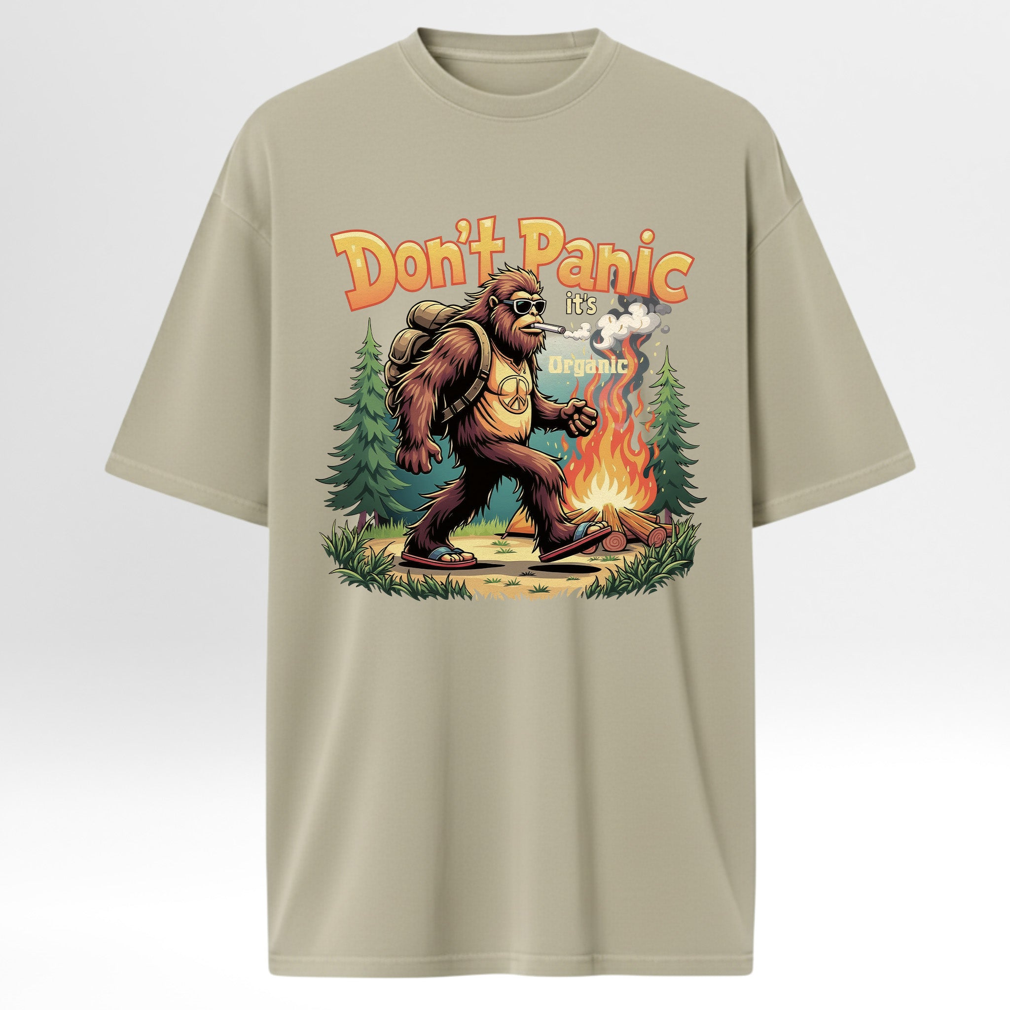 Beige t-shirt with a graphic of a Ape by a campfire and 'Don't Panic it's organic' text 