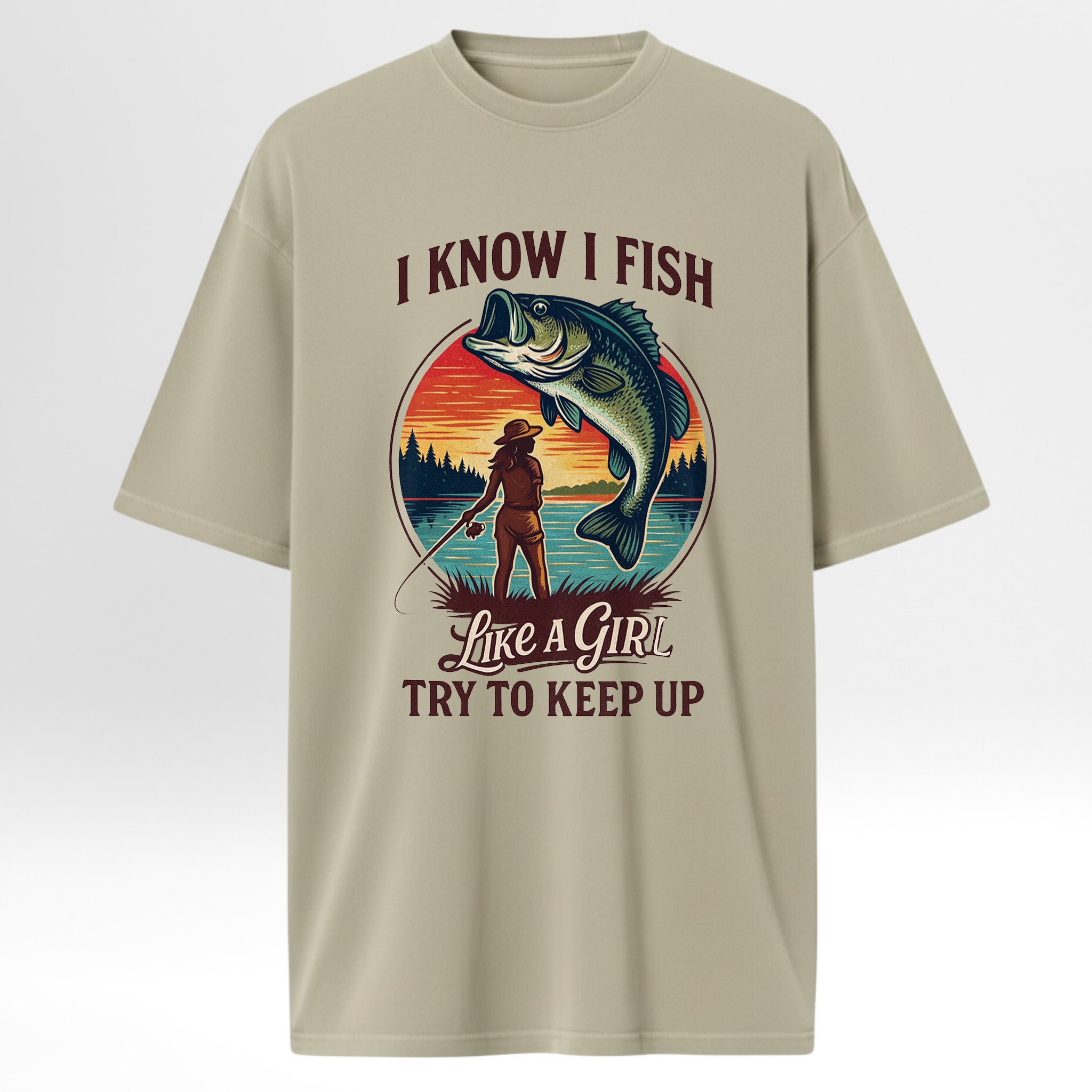 Beige fishing t-shirt with fishing graphic and text 'I Know I Fish Like A Girl Try To Keep Up!'