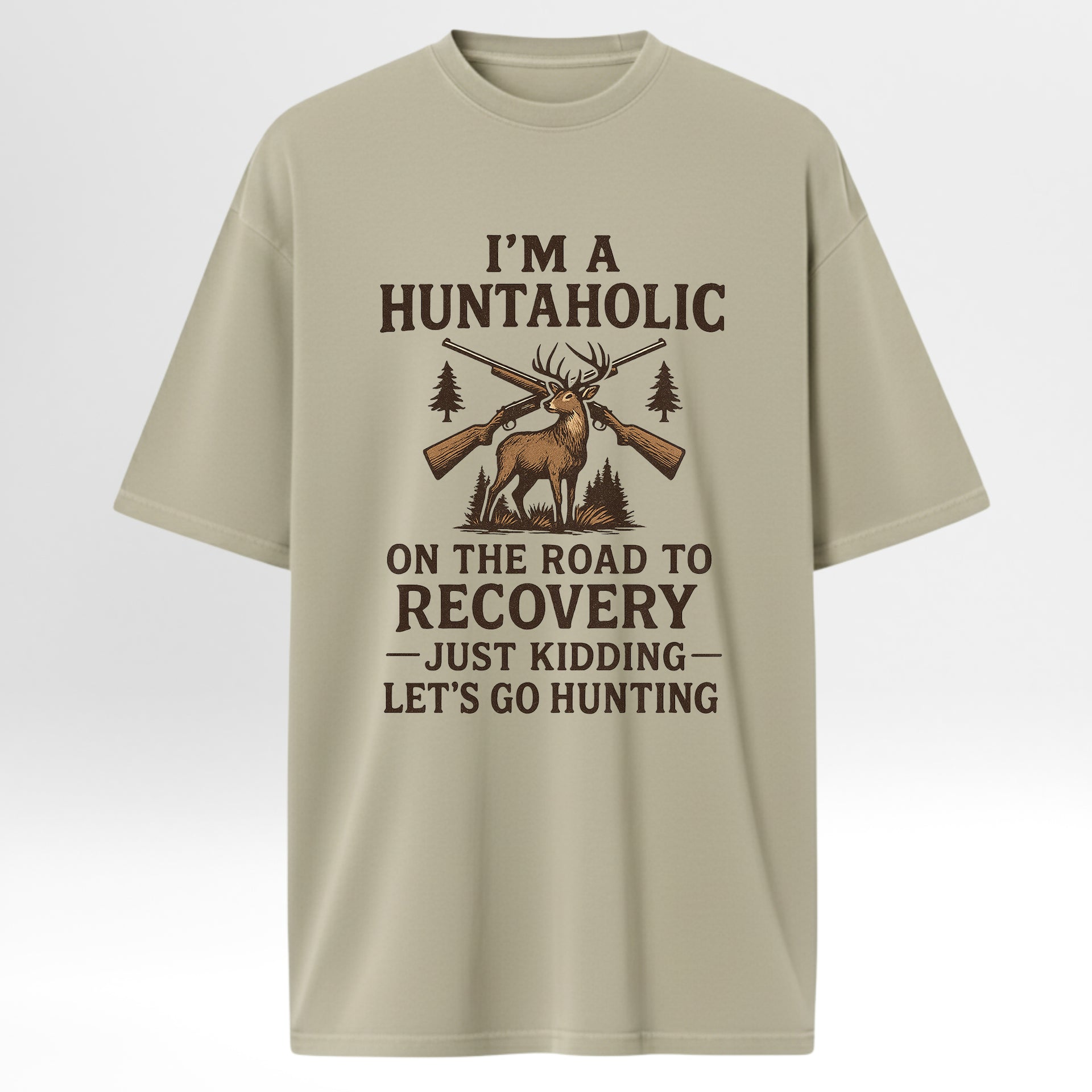 Beige t-shirt with hunting-themed graphic and text 'I'm A Huntaholic On The Road To Recovery Just Kidding Let's Go Hunting'