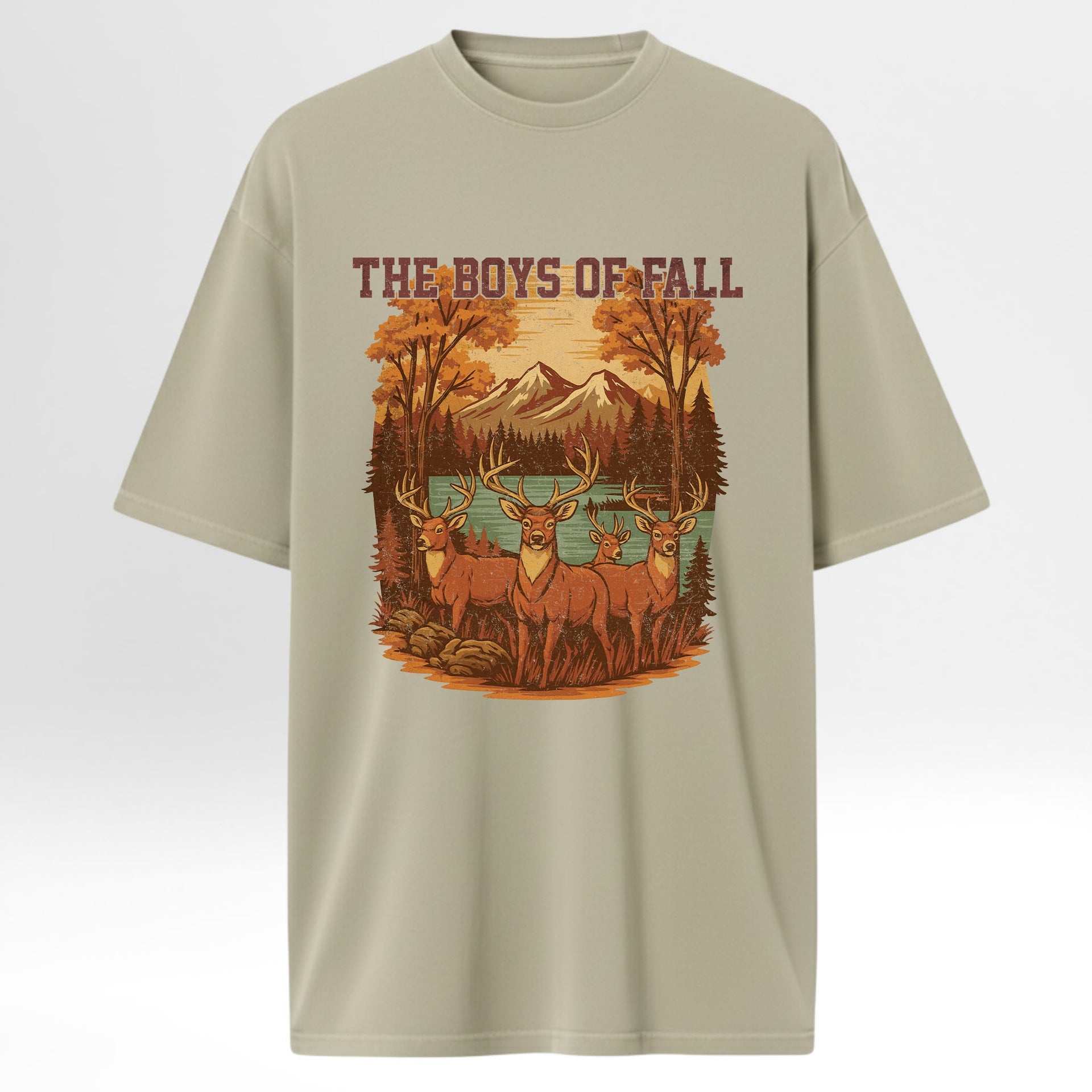 Beige hunting graphic t-shirt with a graphic of deer and mountains and text 'The Boys of Fall' on a white background