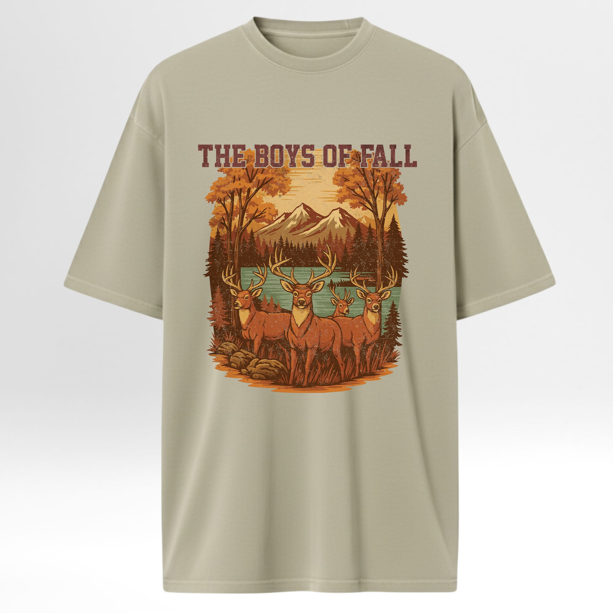 Beige hunting graphic t-shirt with a graphic of deer and mountains and text 'The Boys of Fall' on a white background