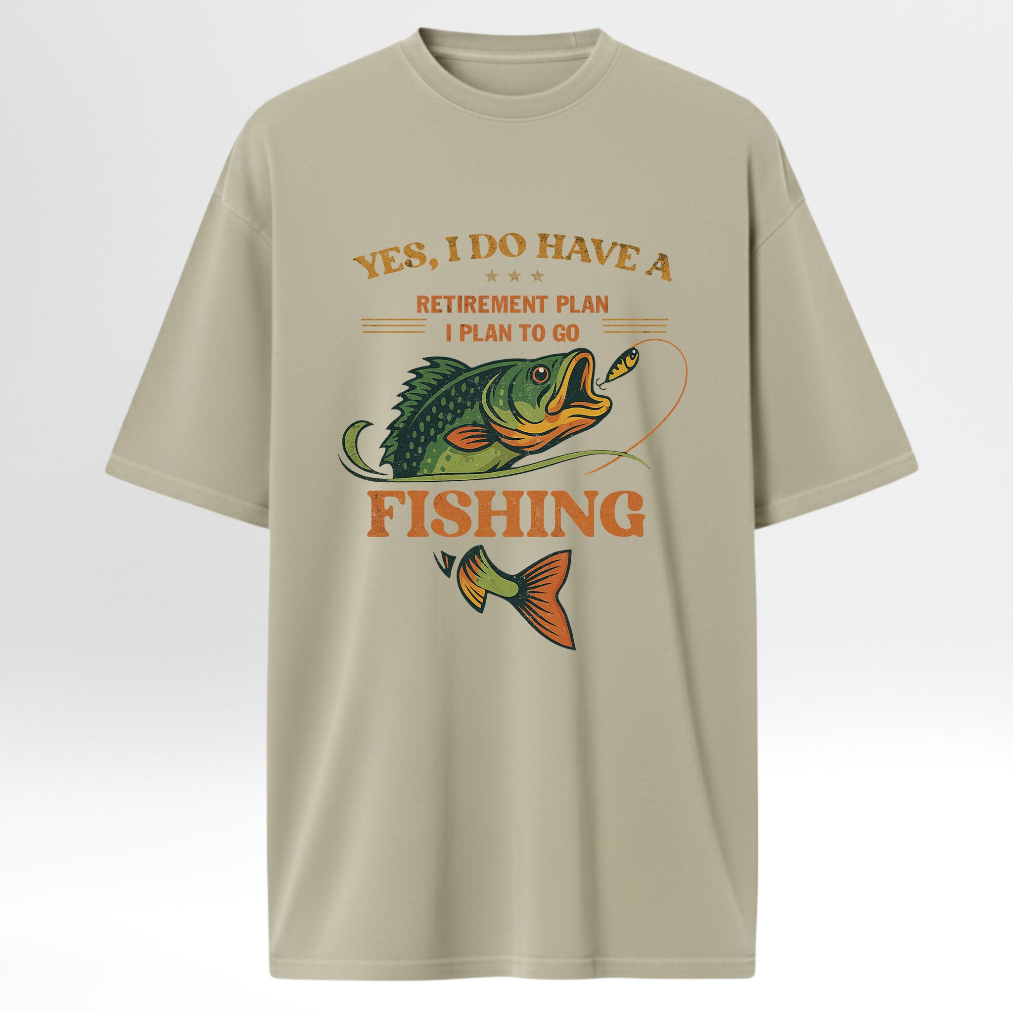 Beige t-shirt with fishing graphic and text 'Yes I Do Have A Retirement Plan I Plan To Go Fishing'