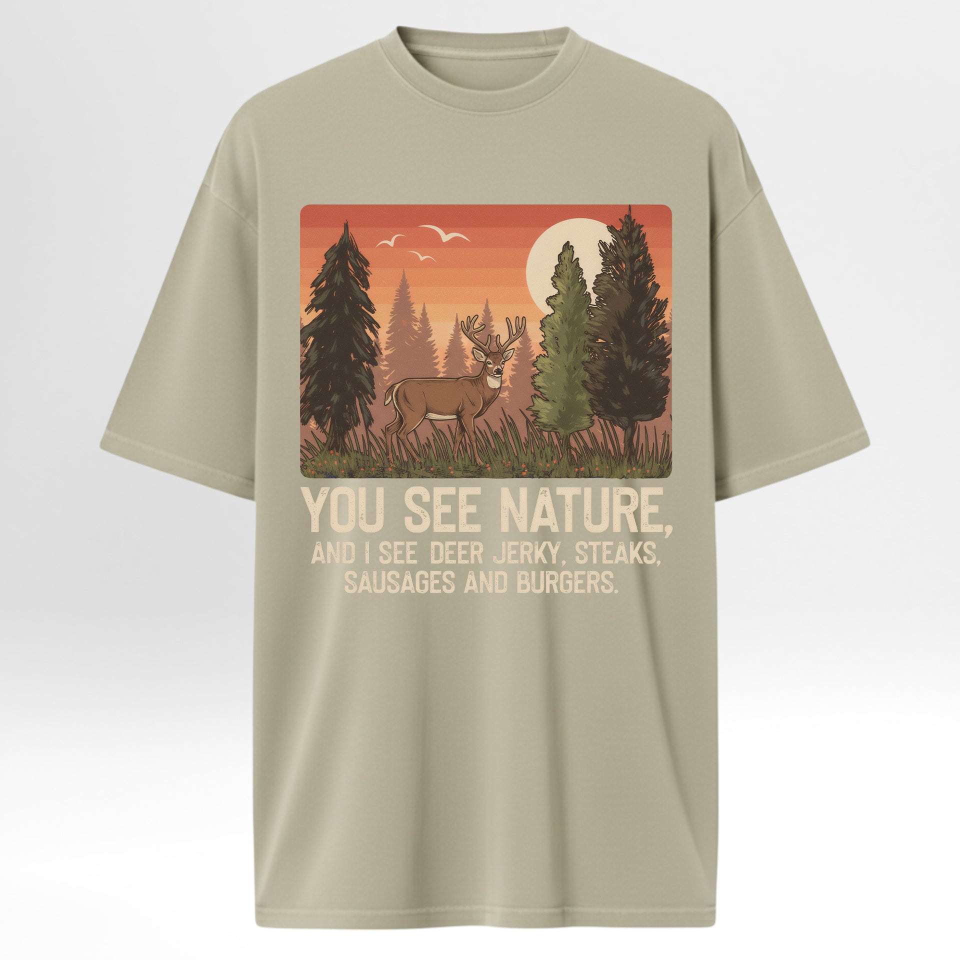 Beige t-shirt with a graphic of a deer in a forest and humorous text 'You See Nature And I See A Deer Jerky Steaks Sausages And Burgers'