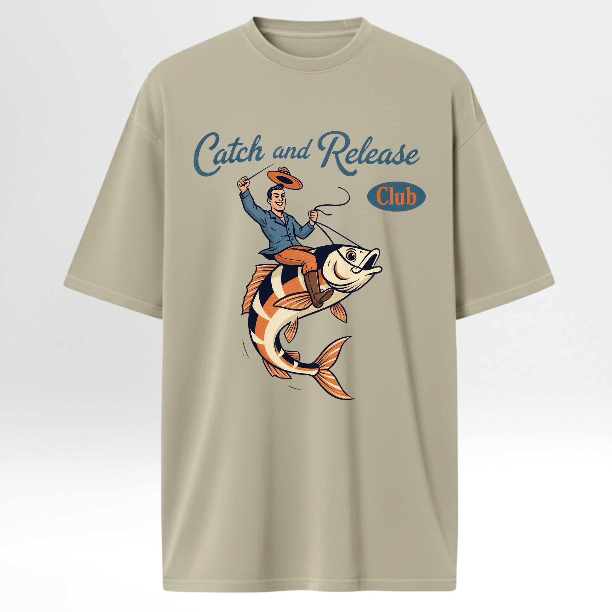 Beige fishing t-shirt with a graphic of a man on a fish and 'Catch and Release Club' text.