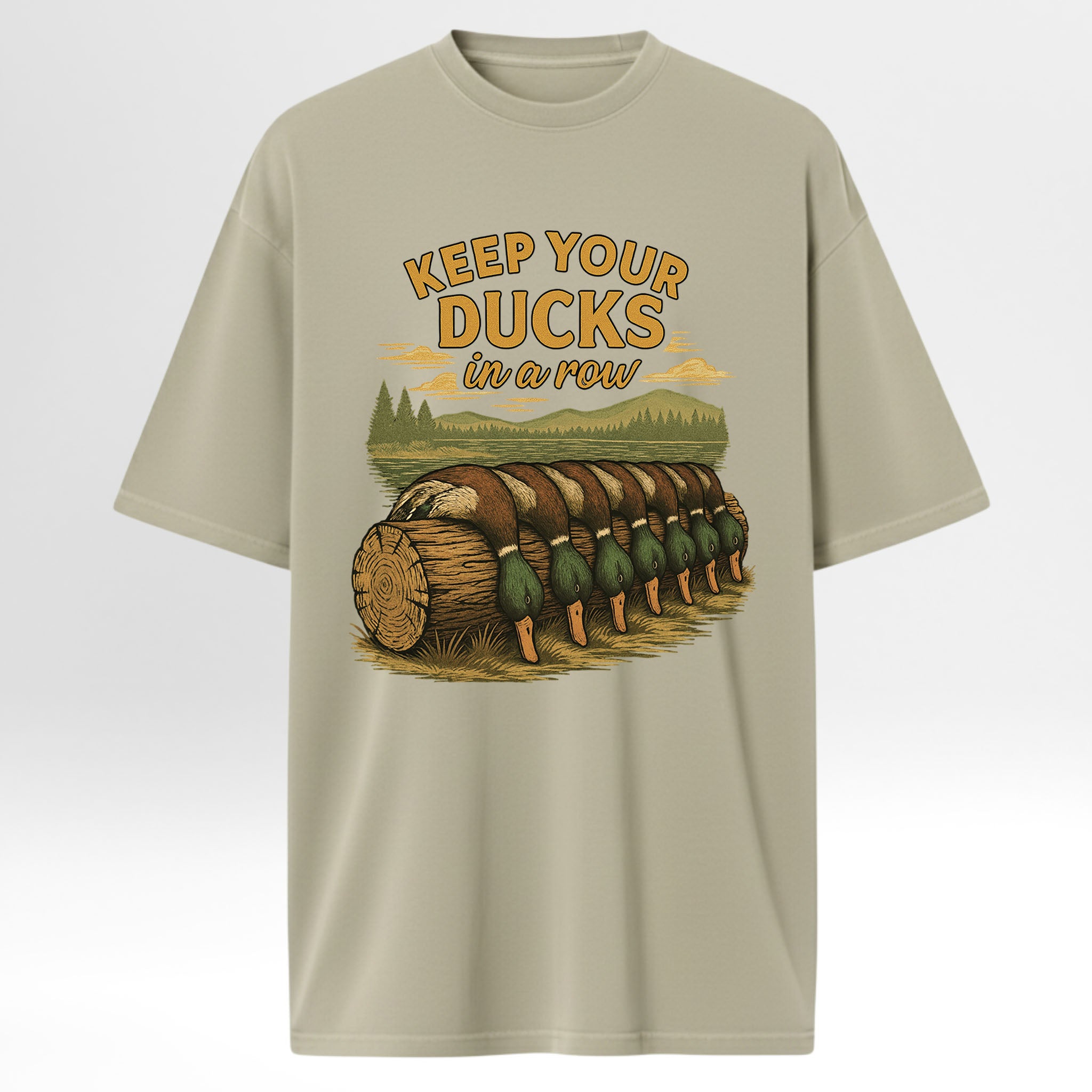 Beige hunting t-shirt with duck graphic and text 'Keep your ducks in a row' 