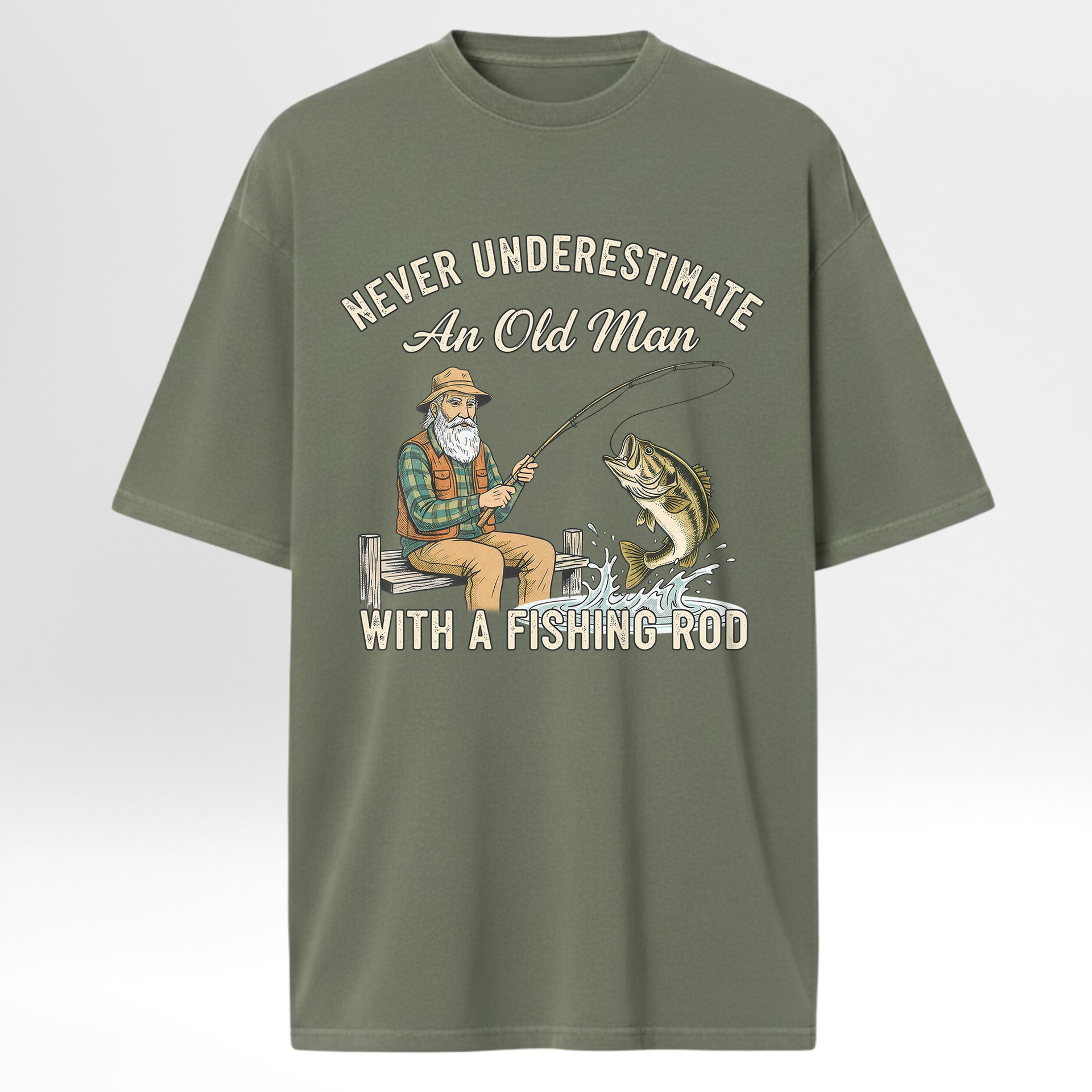 Green fishing t-shirt with fishing graphic and text 'Never Underestimate An Old Man With A Fishing Rod'.