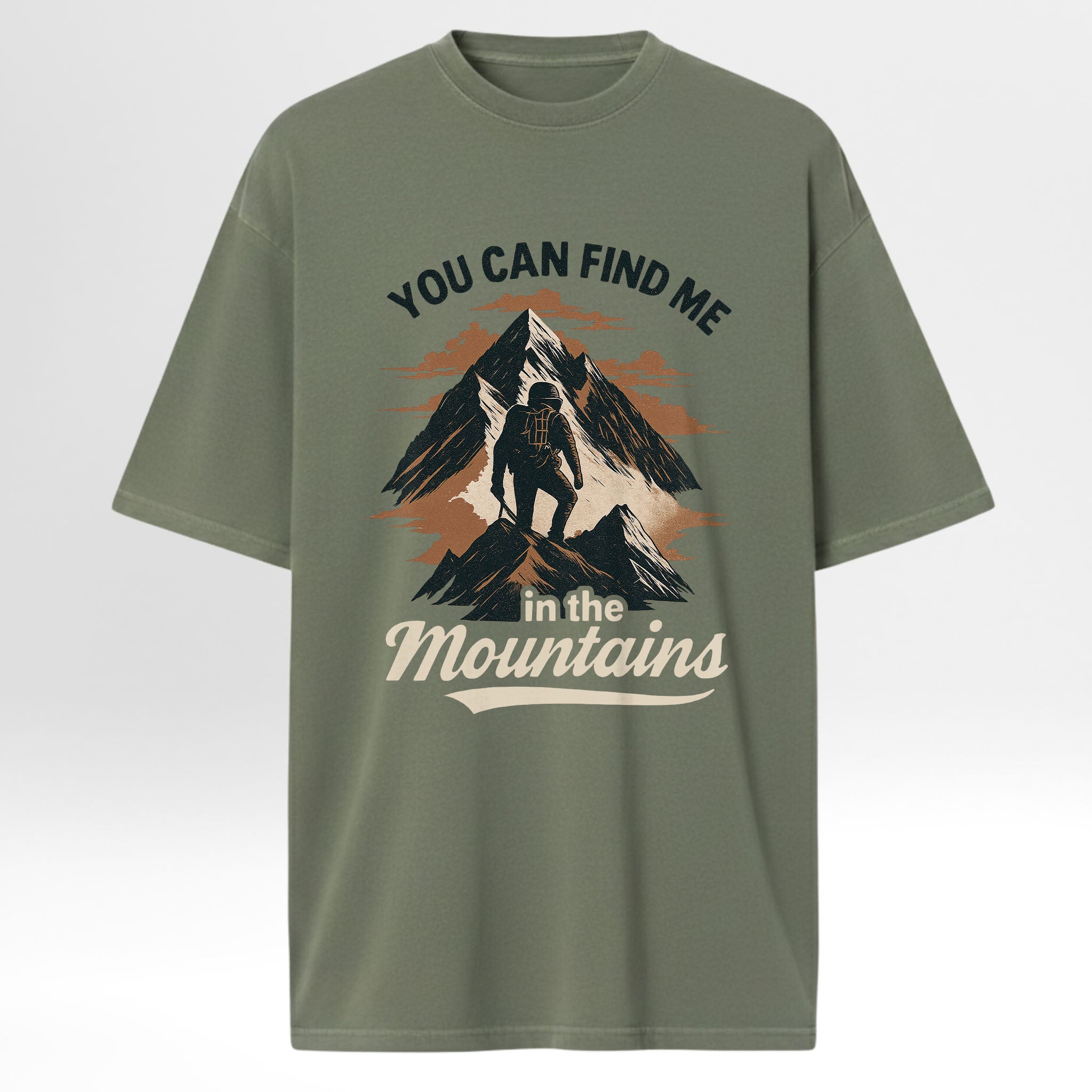 Green camp & trail t-shirt with mountain graphic and text 'You Can Find Me In The Mountains'.