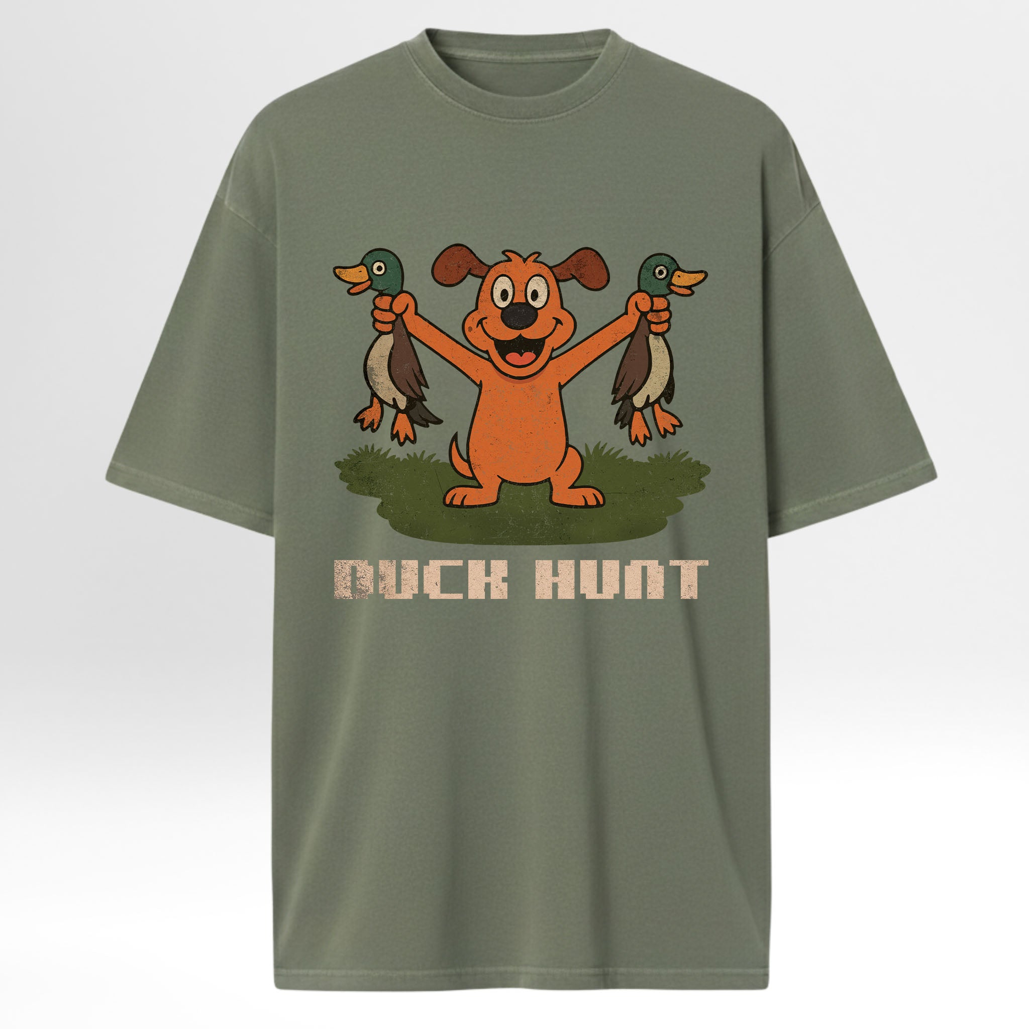 Green hunting graphic t-shirt with cartoon dog holding two ducks and 'Duck Hunt' text on a white background