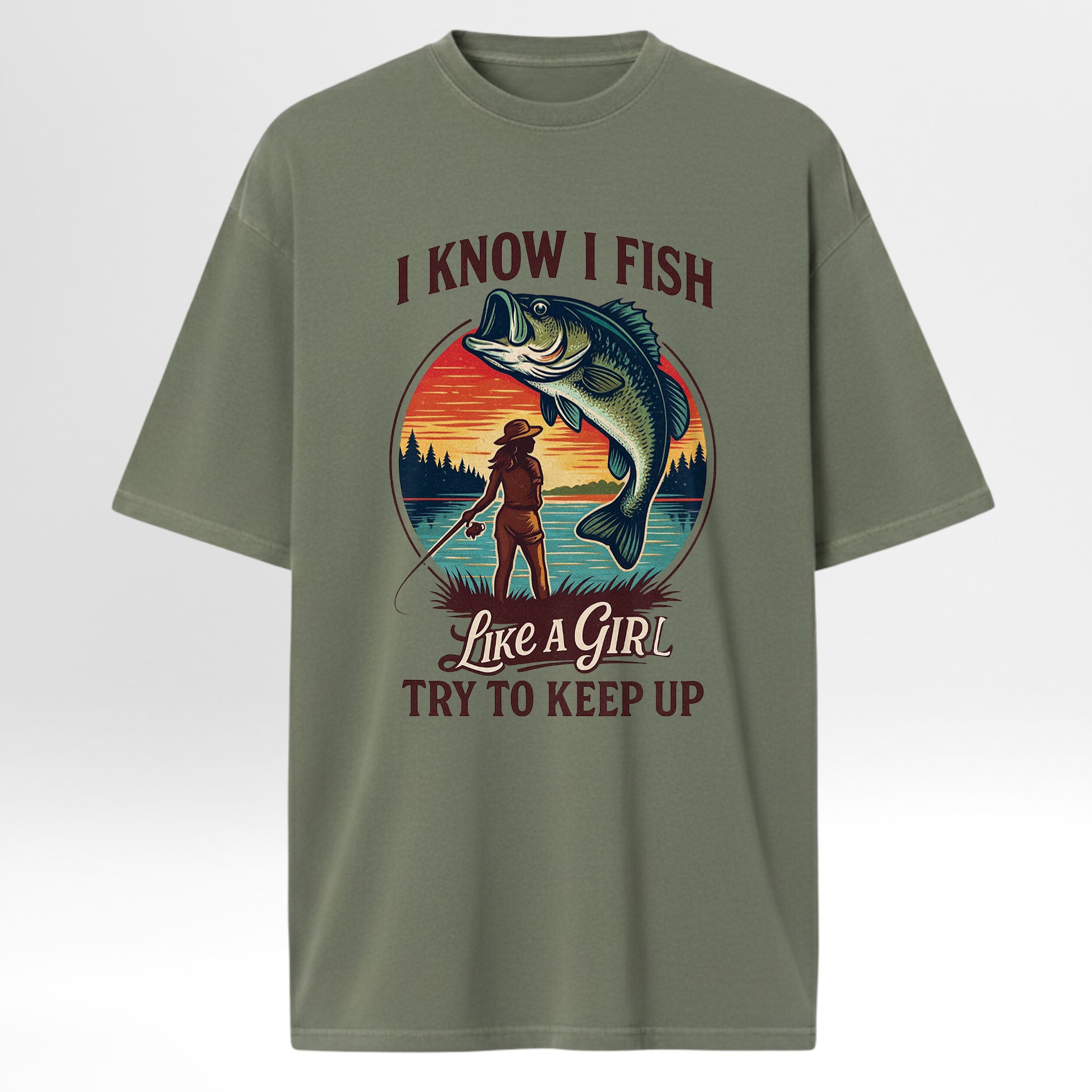 Green fishing t-shirt with fishing graphic and text 'I Know I Fish Like A Girl Try To Keep Up!'
