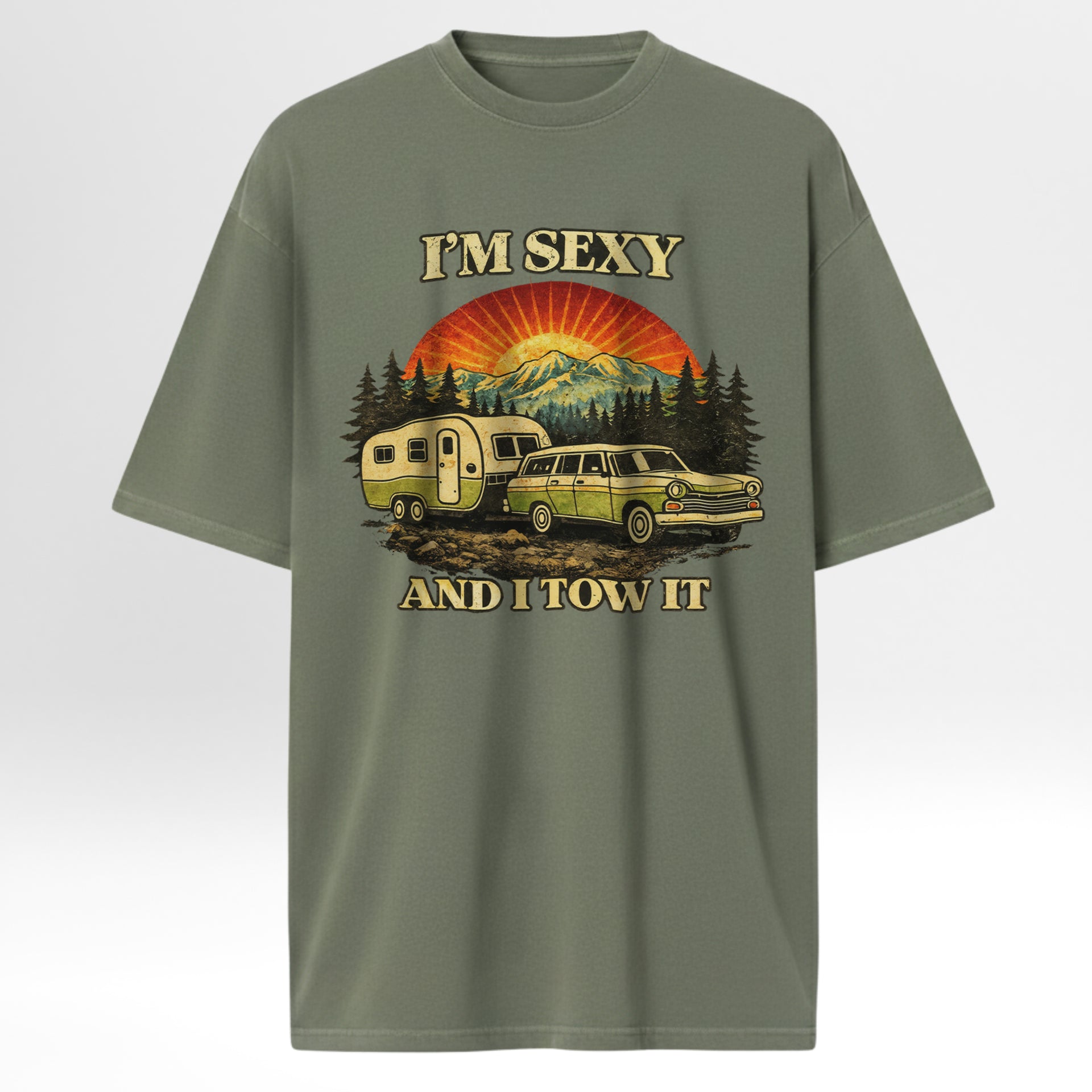 Green outdoor t-shirt with a graphic design of a car towing a camper and text 'I'm Sexy and I Tow It'.