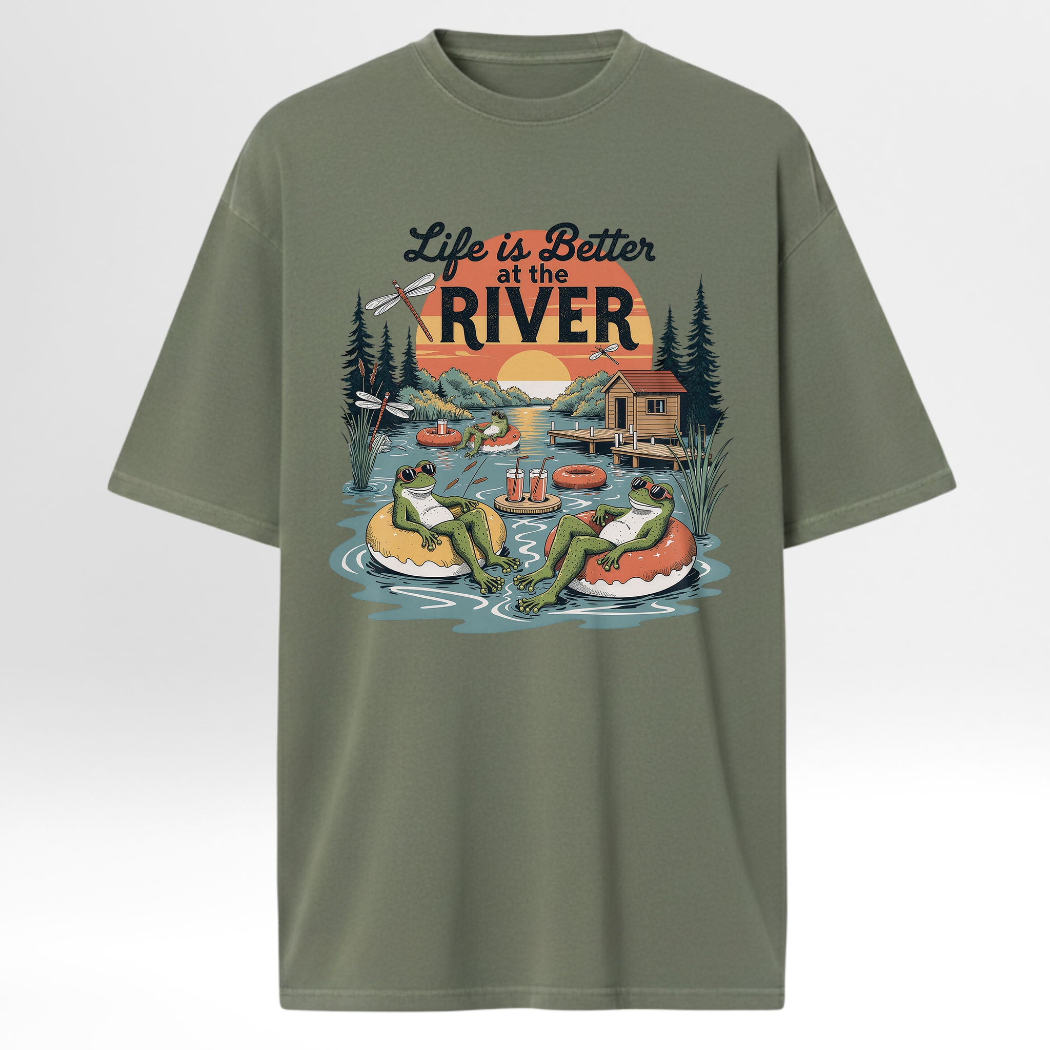 Green t-shirt with 'Life is Better at the River' graphic design featuring frogs and a cabin.