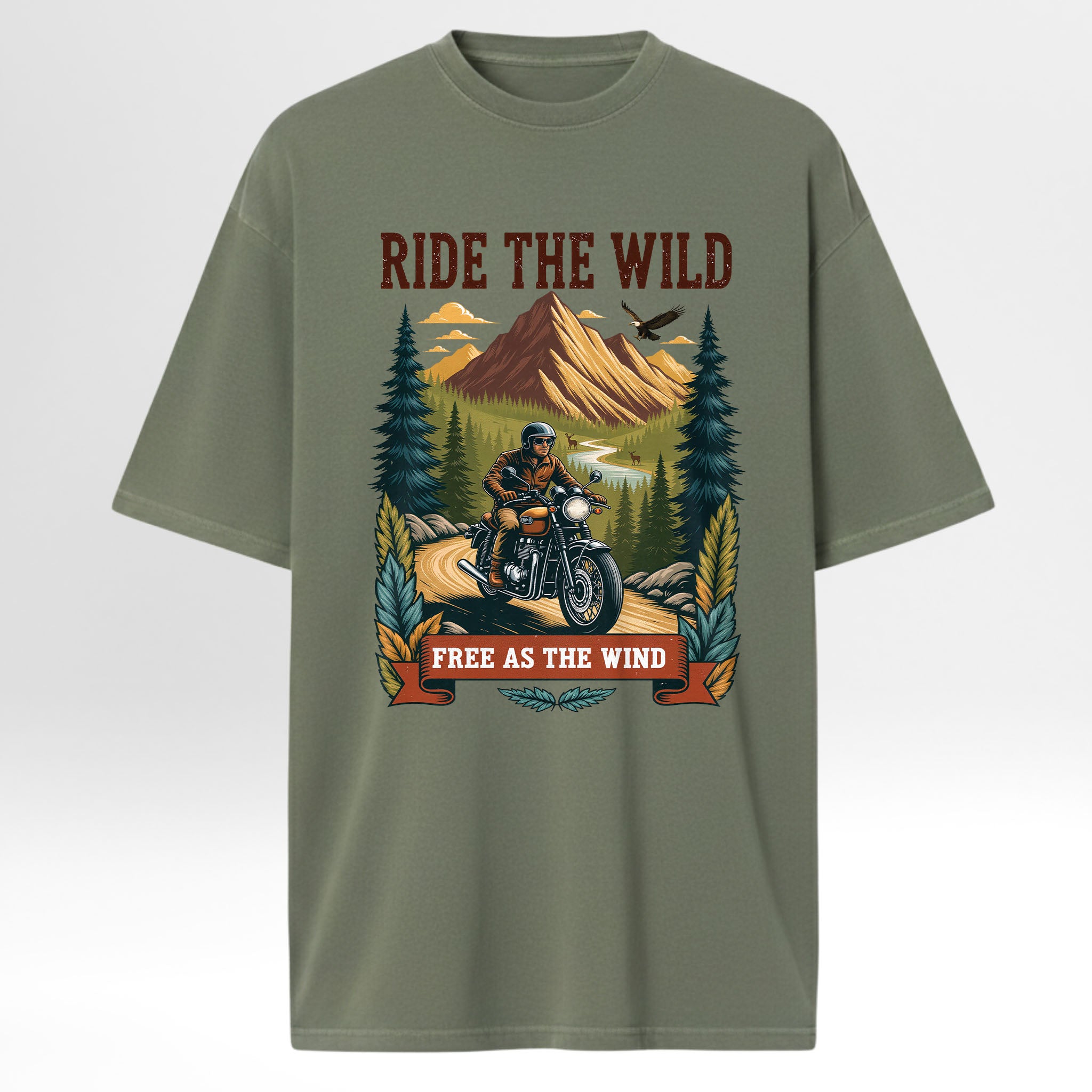 Green trail graphic t-shirt with a graphic of a person on a motorcycle in a forest and text 'Ride the Wild, Free as the Wind' on a white background.